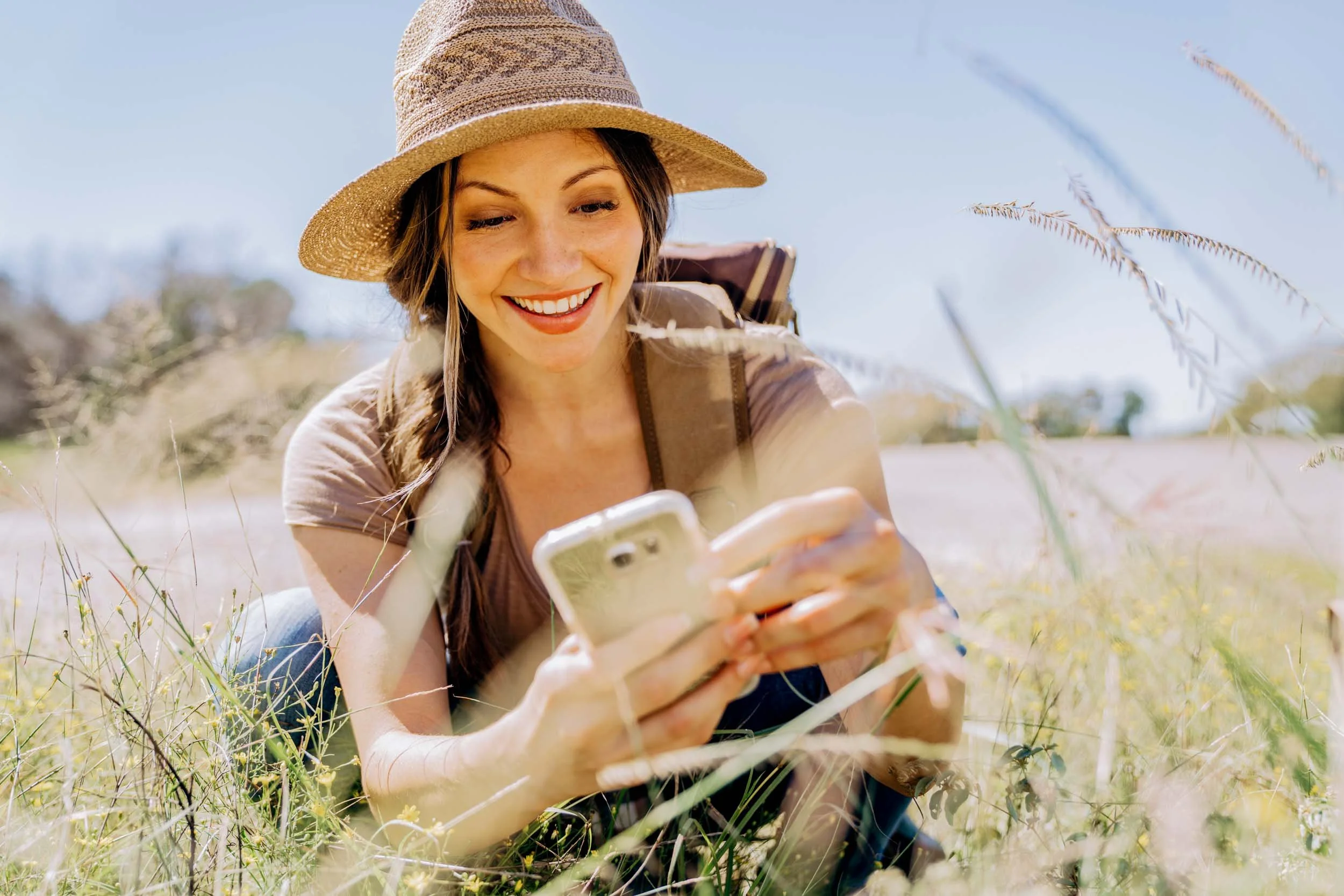 Woman-Taking-Photo-with-Smartphone-Outdoors.jpg