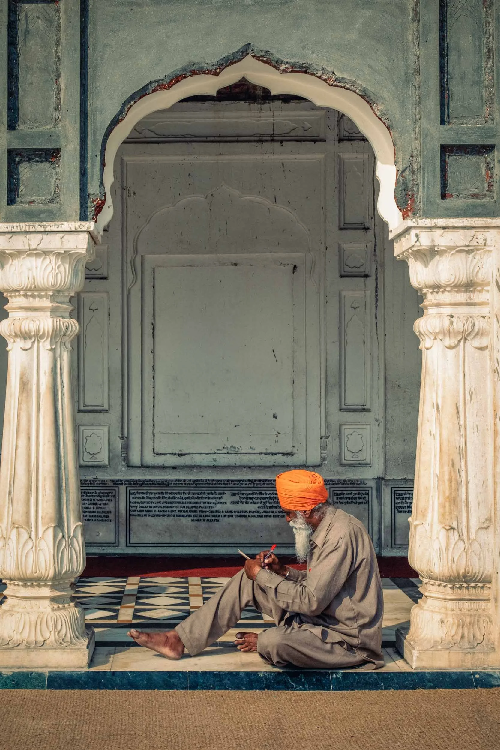 Elderly-Sikh-Man-Writing-in-Temple.jpg