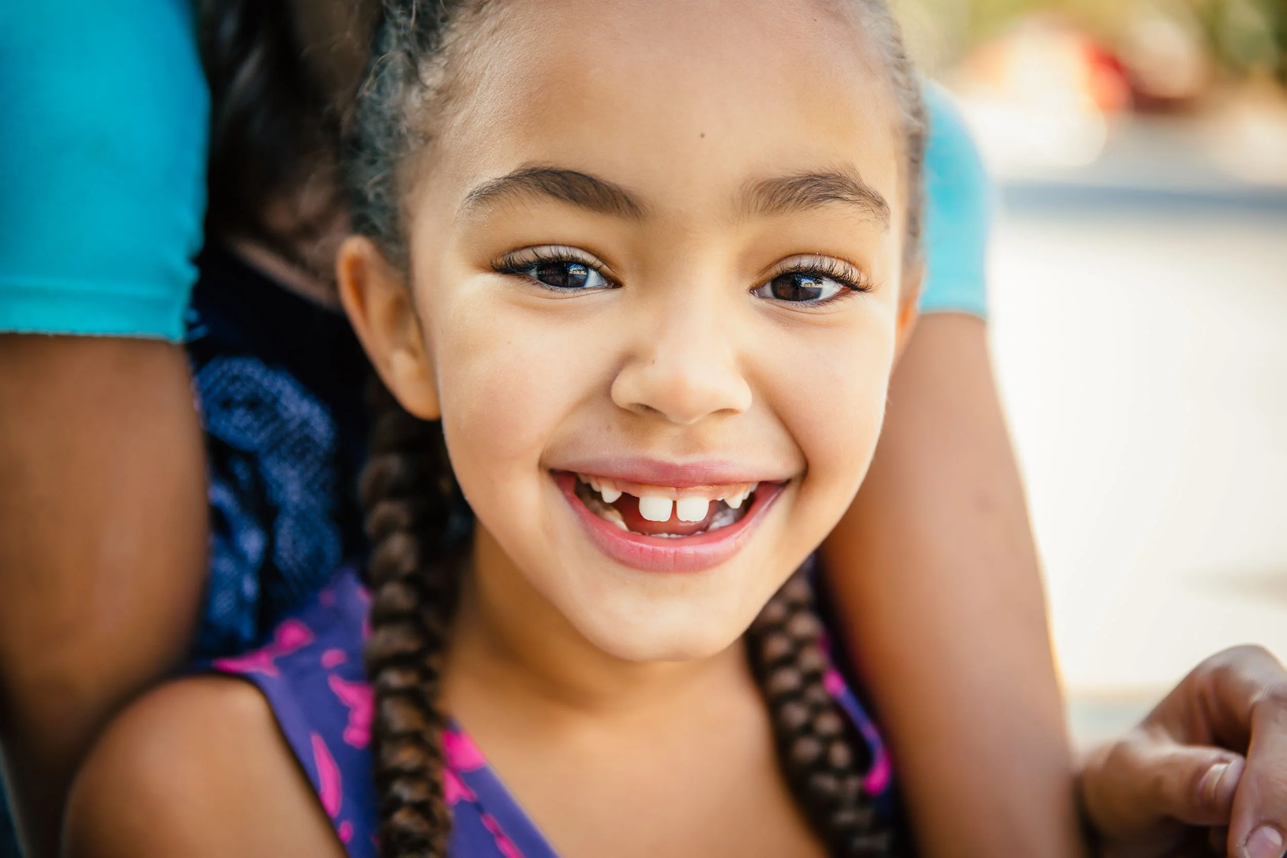 Young-Girl-Smiling-Outdoors.jpg