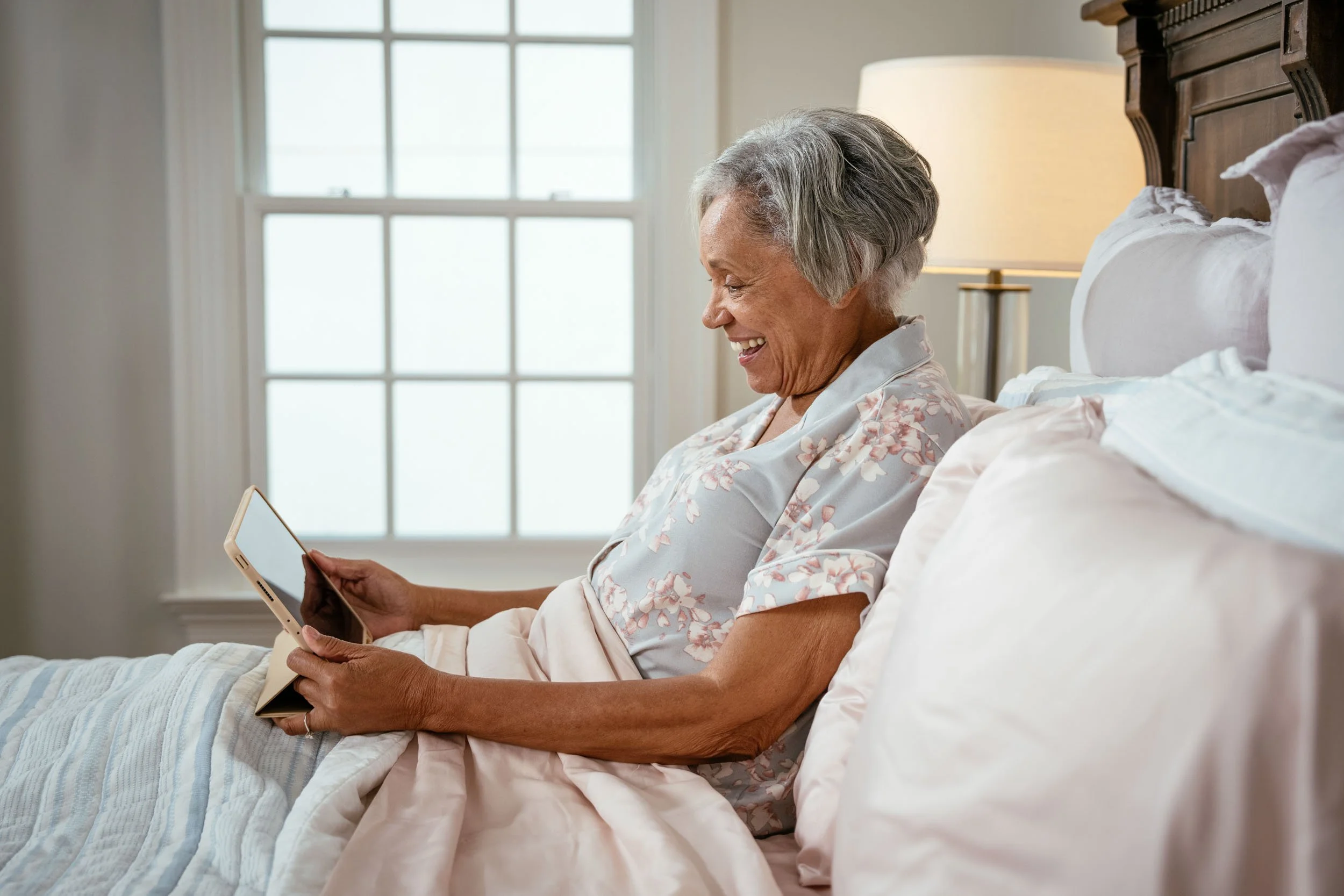 Elderly-Woman-with-Tablet-in-Bed.jpg