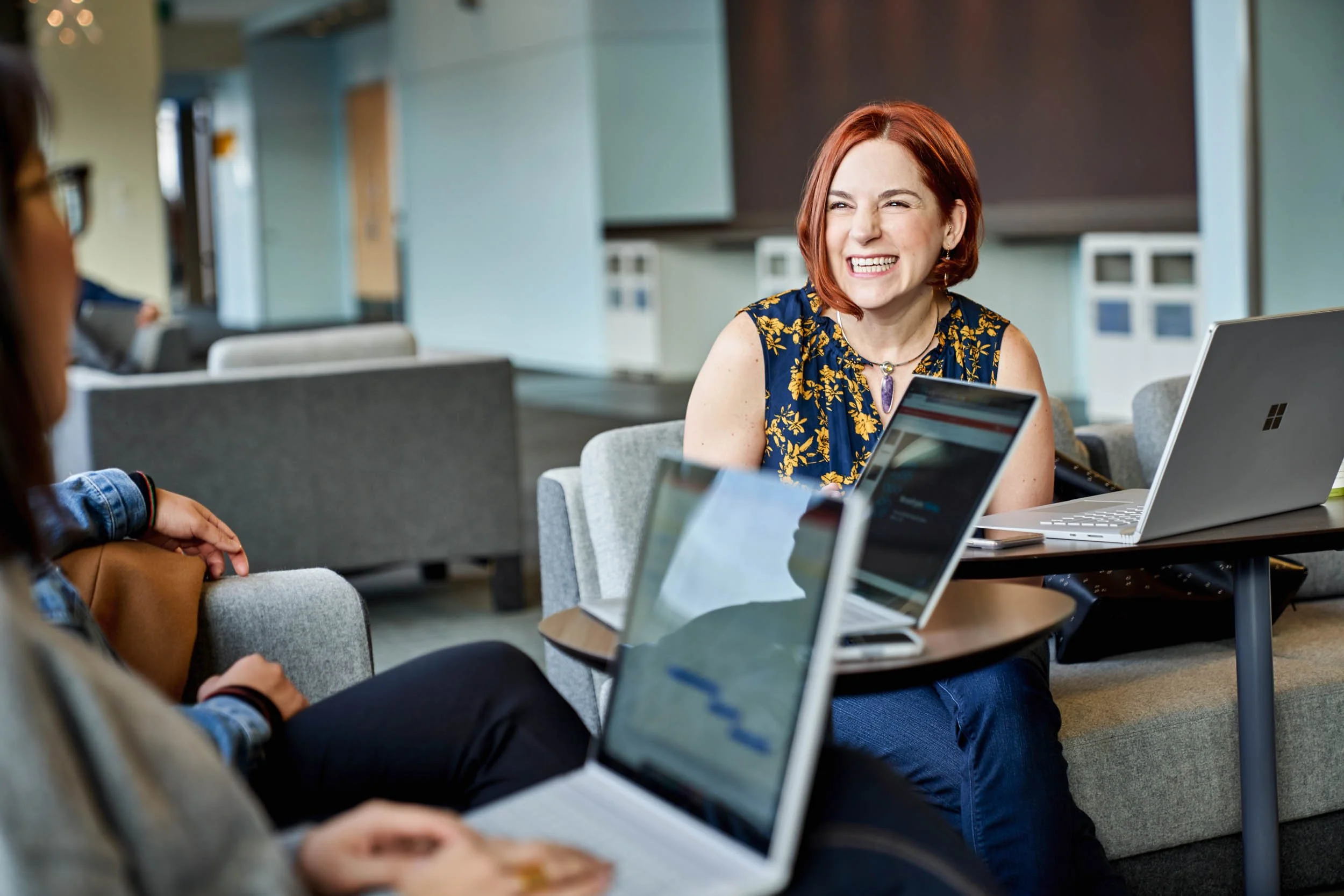 Smiling-woman-in-casual-tech-business-meeting.jpg