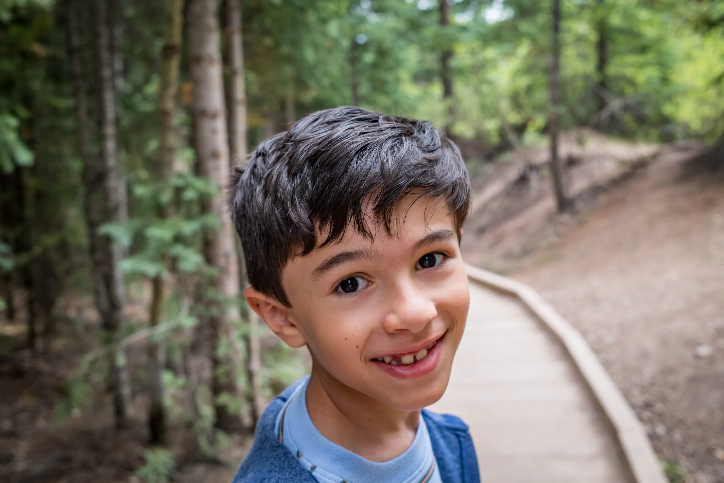 Boy-Smiling-in-the-Forest.jpg