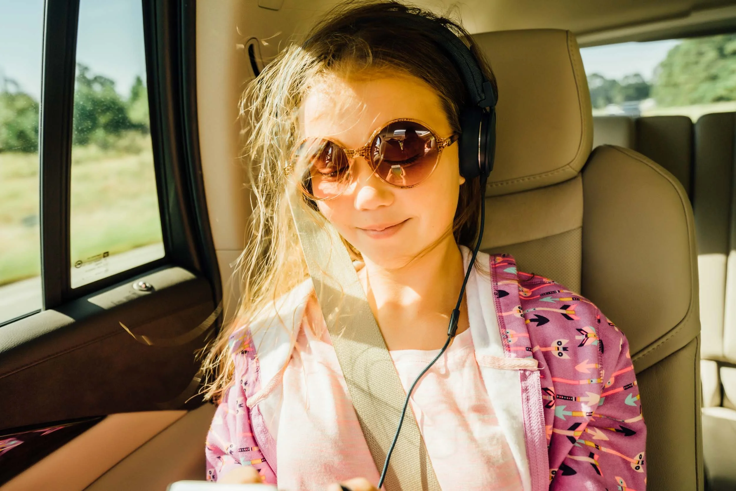 Girl-Listening-to-Music-in-Car-on-Headphones.jpg