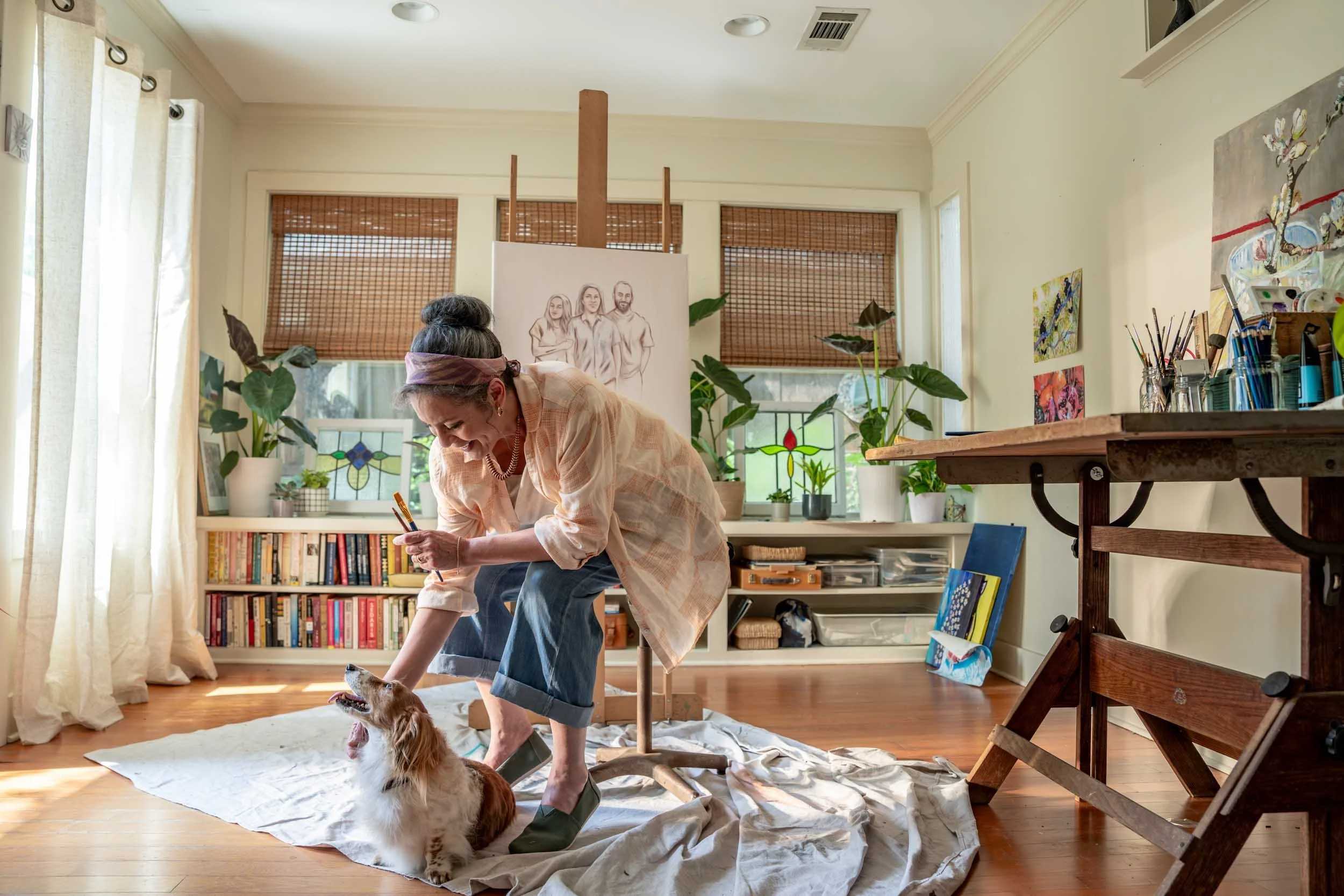 Woman-Petting-Dog-in-Art-Studio.jpg