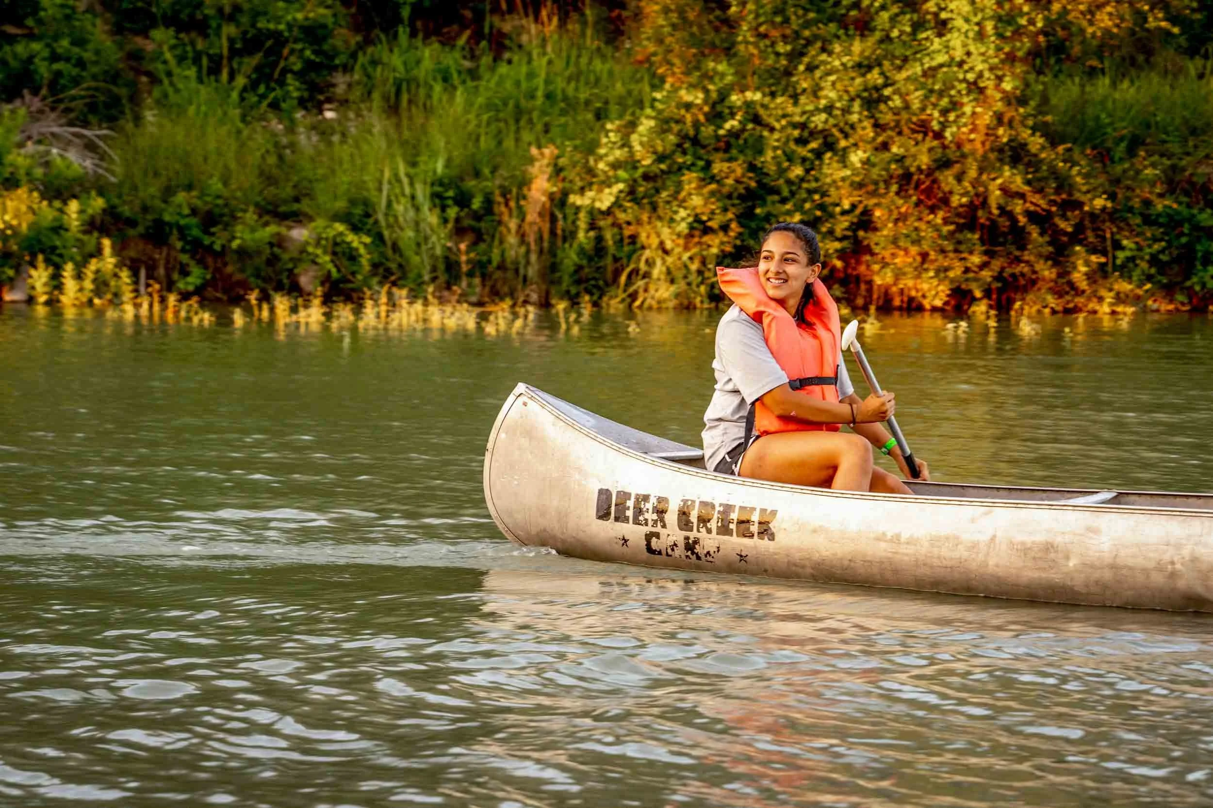 Girl-Canoeing-on-a-Calm-River.jpg