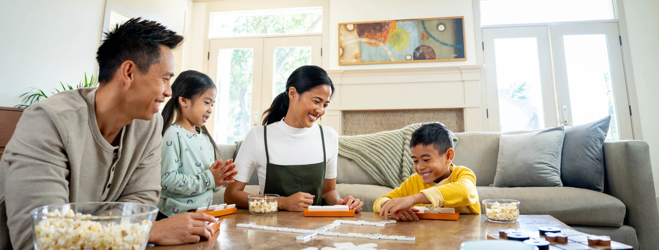 Family-Playing-Game-Together-in-Living-Room.jpg