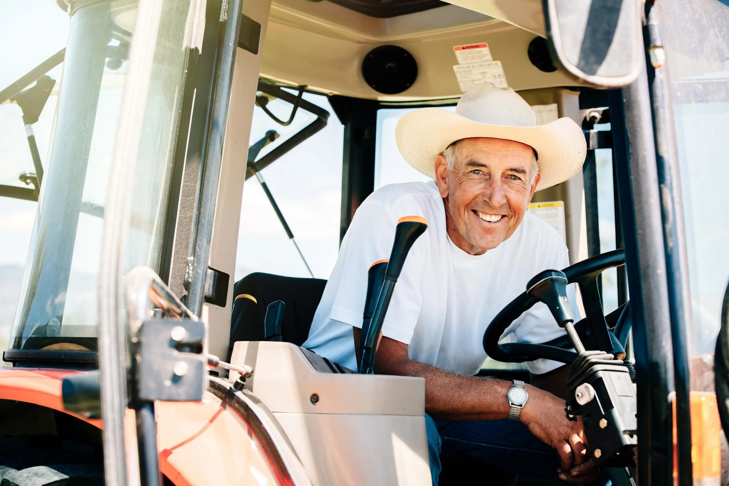 Smiling-Cowboy-in-Tractor.jpg