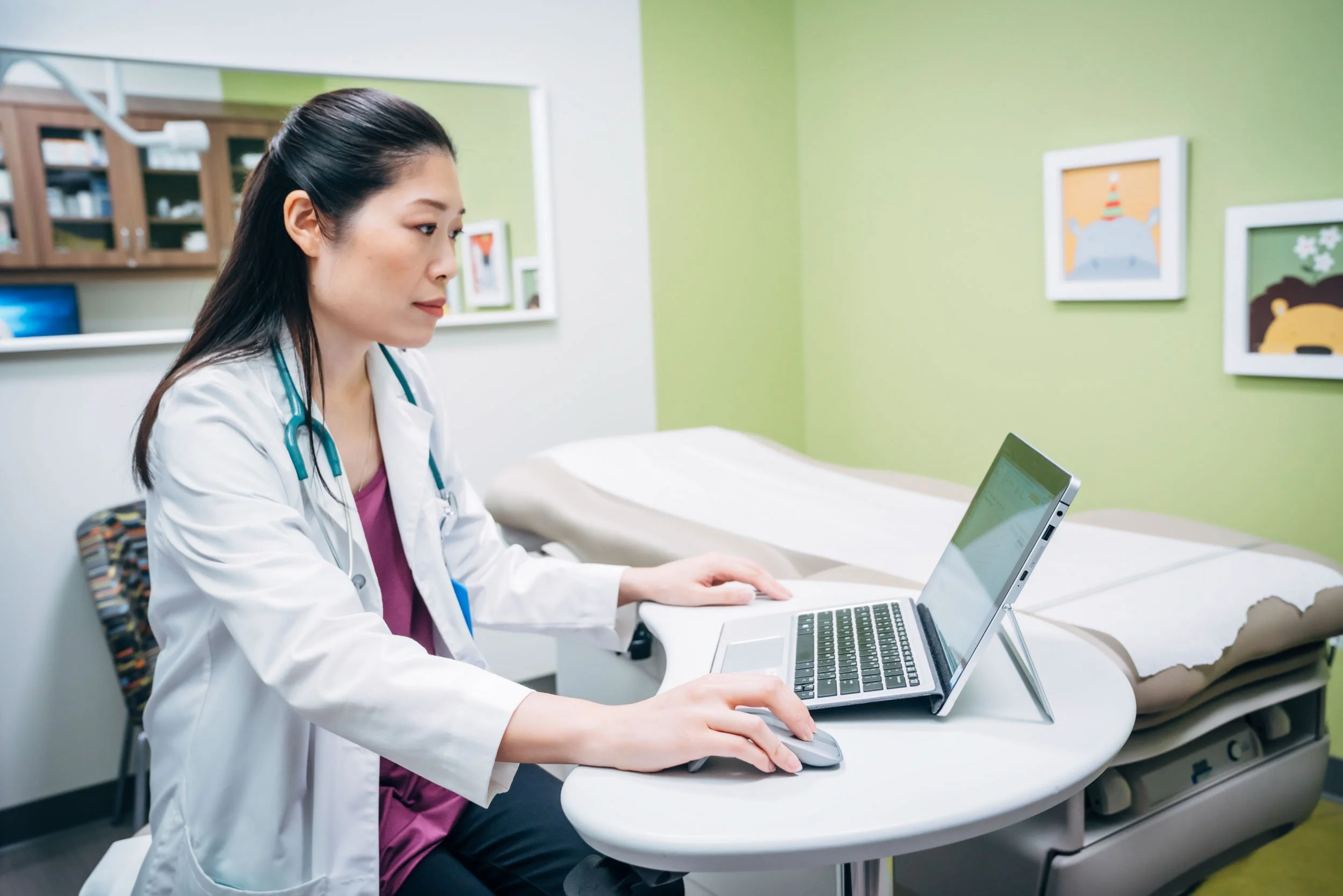 Doctor-on-Laptop-in-Exam-Room.jpg