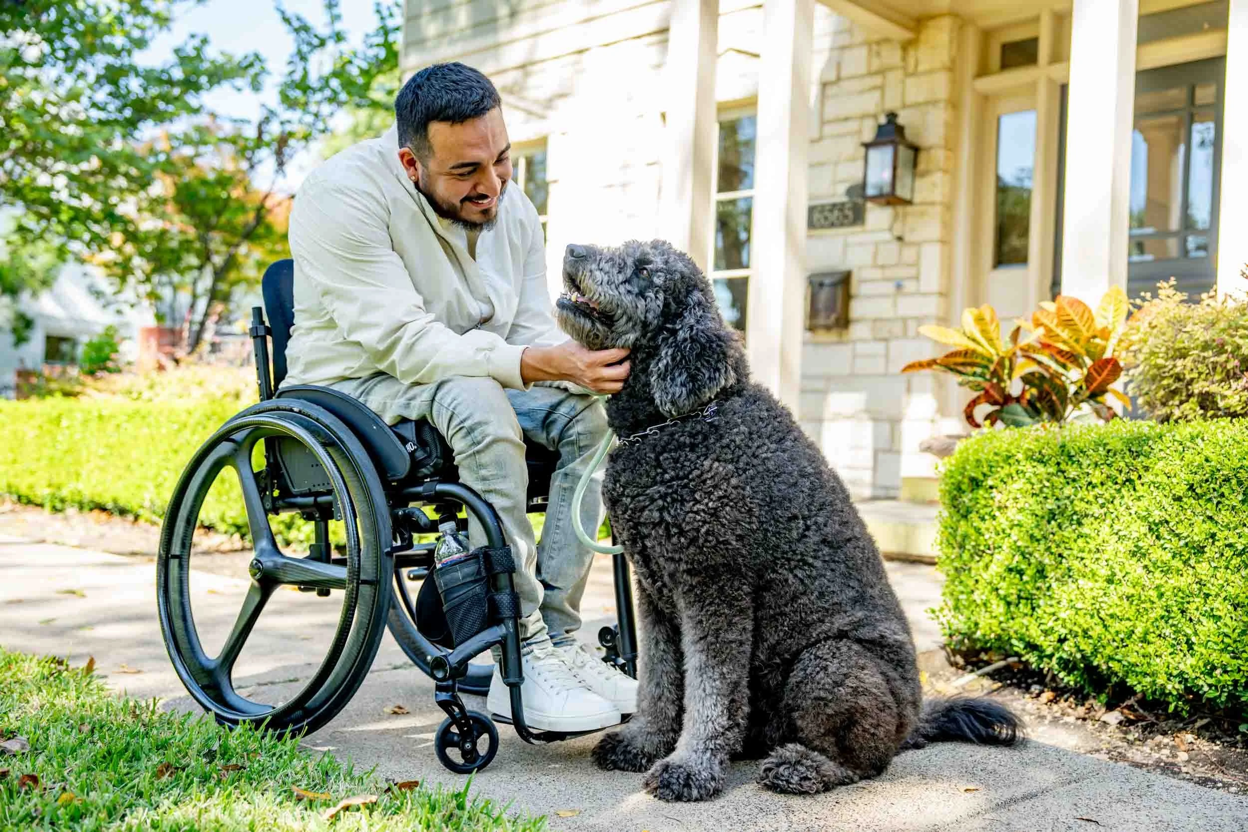 Man-in-Wheelchair-with-Dog-Outside.jpg