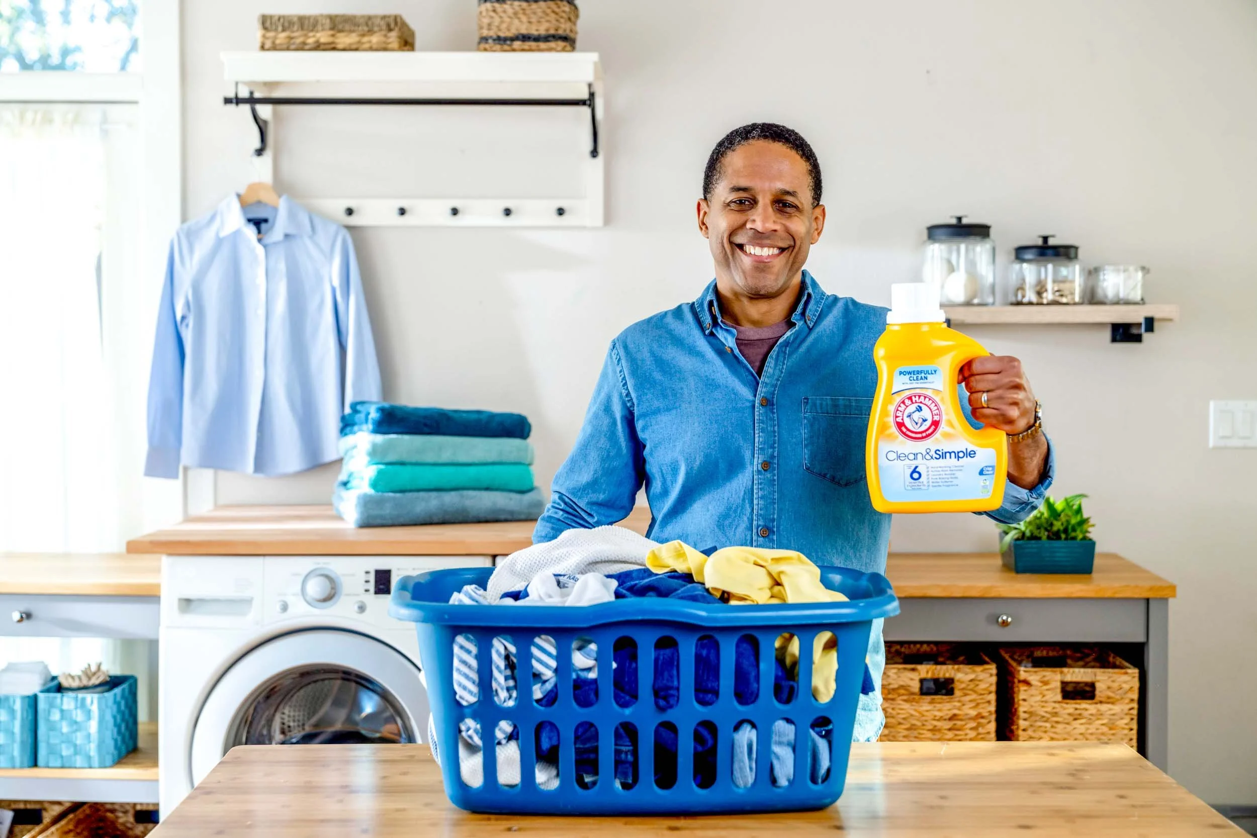 Man-holding-Bottle-of -Arm-and-Hammer-detergent.jpg