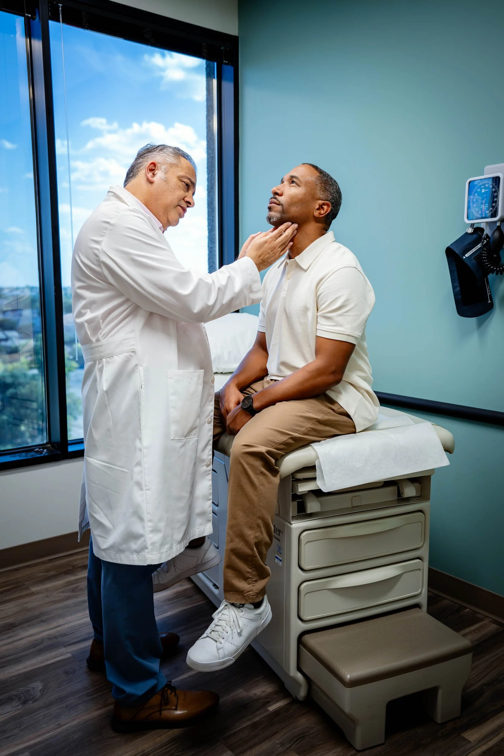 Doctor-Examines-Adult-Male-Patient-in-Clinic.jpg