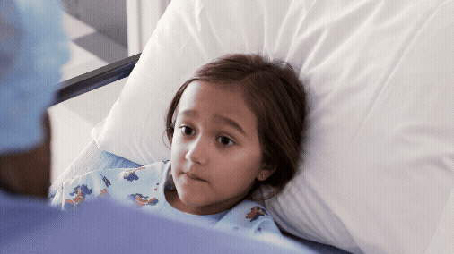 Nurse-Talking-to-Girl-in-Hospital-Bed.gif