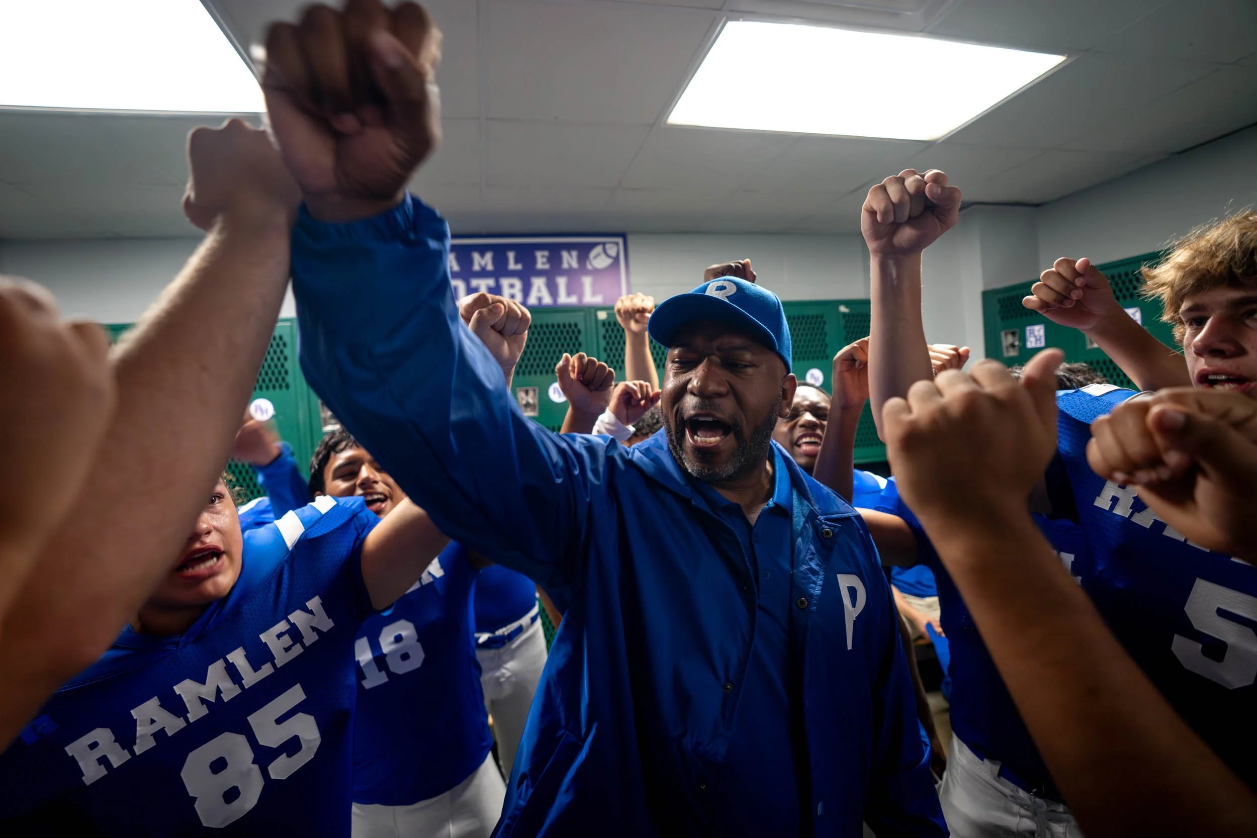 Football-Team-Cheering-in-Locker-Room.jpg