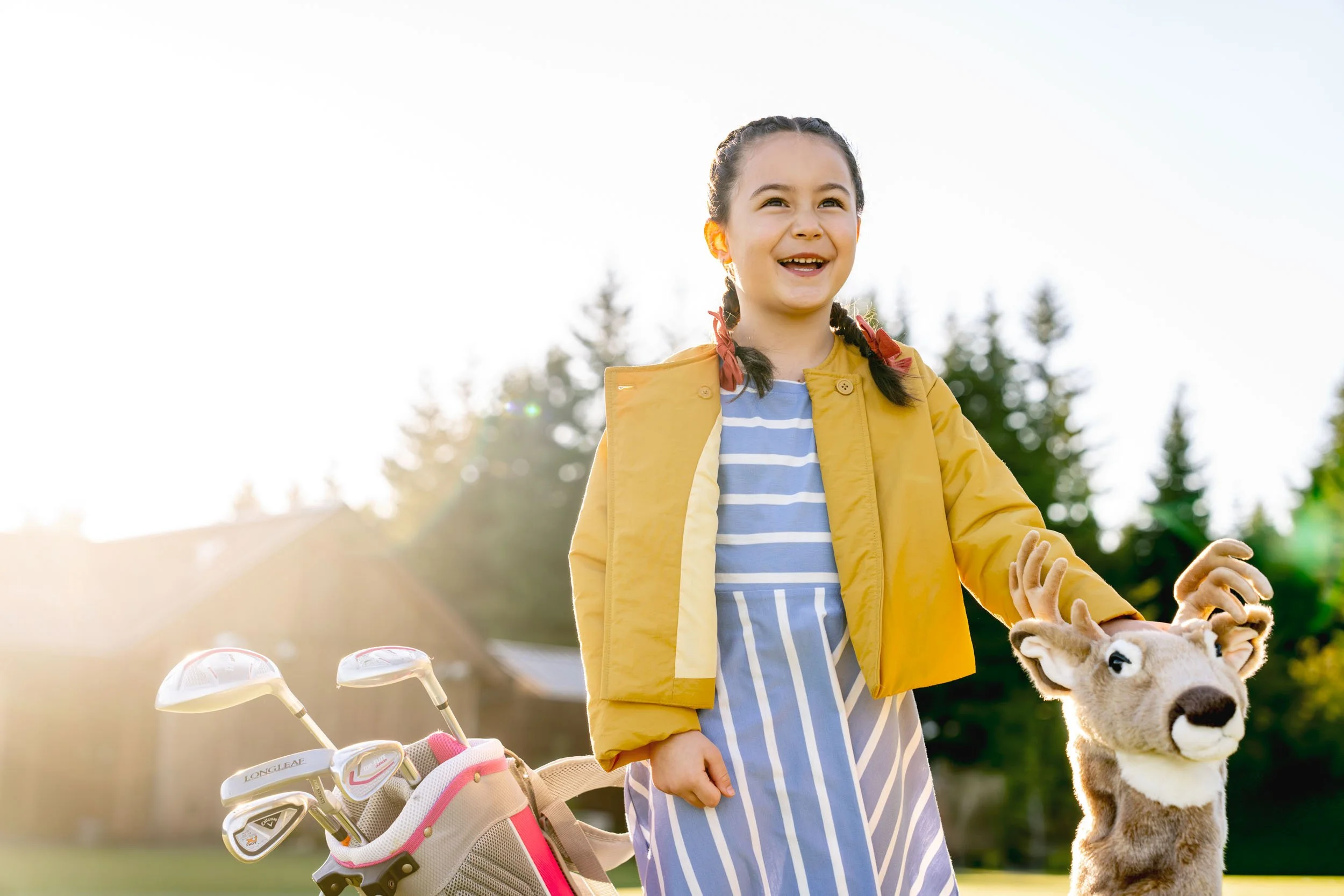Smiling-Girl-on-Golf-Course-with-Clubs-2.jpg