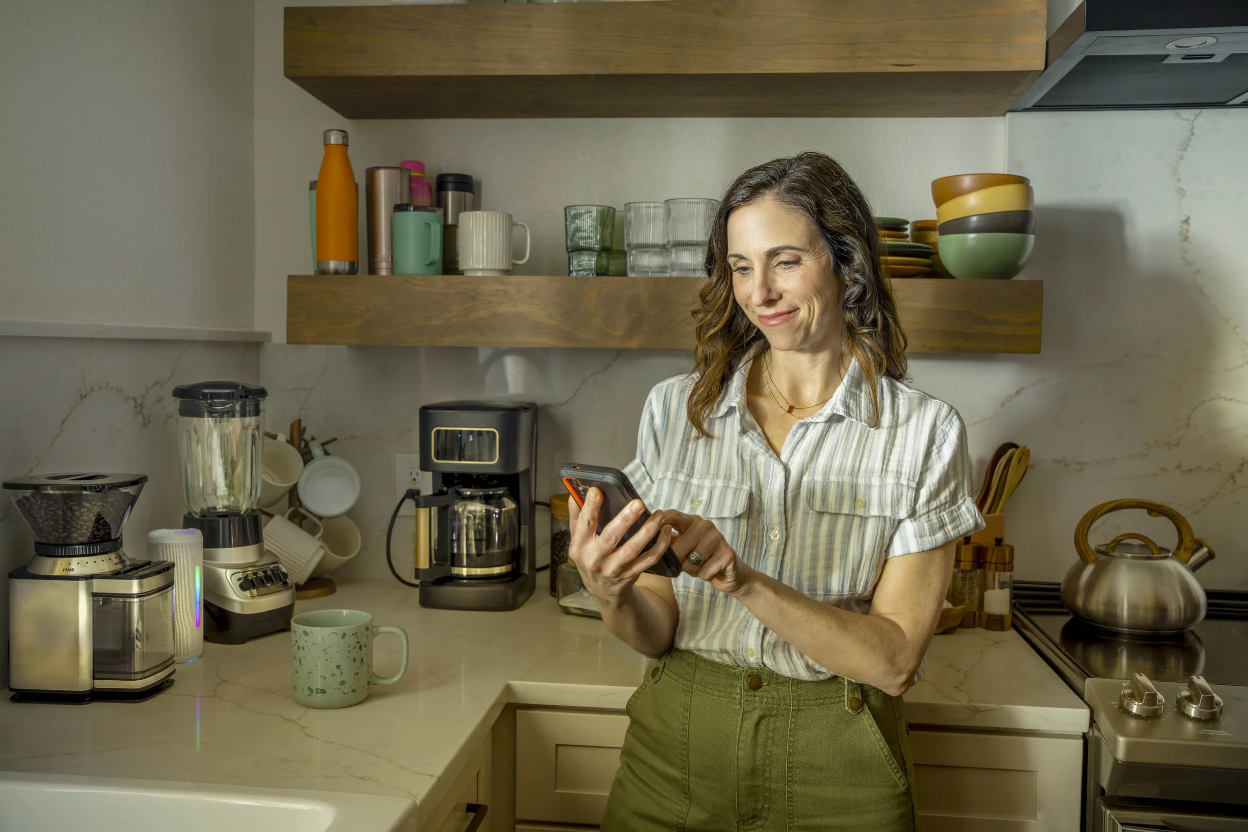 Woman-in-Kitchen-with-Smartphone.jpg