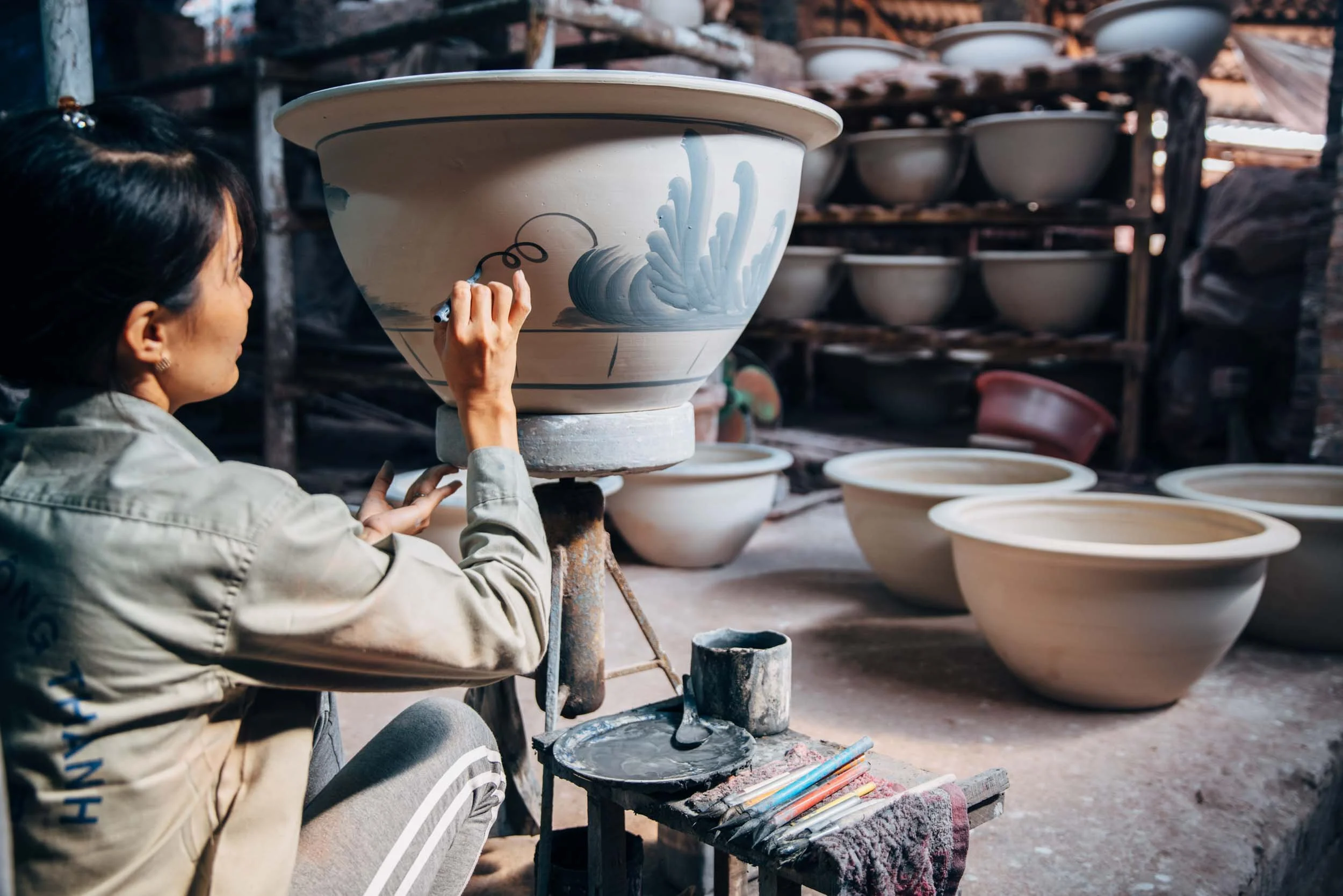 Woman-Hand-Painting-Clay-Pot.jpg
