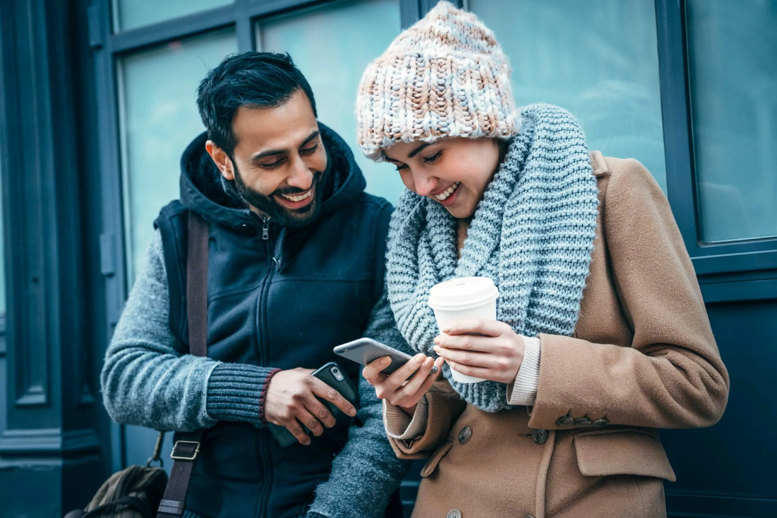 Two-People-with-Cell-Phones-and-Coffee.jpg