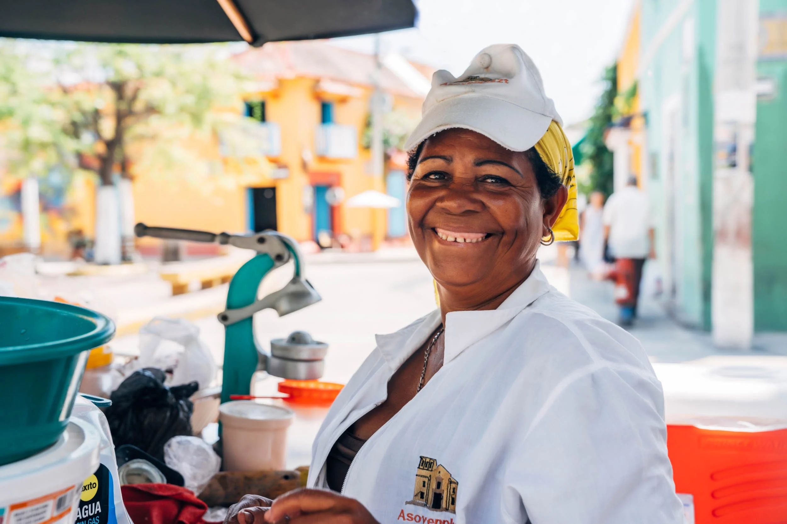 Smiling-Woman-with-Street-Food-Cart.jpg