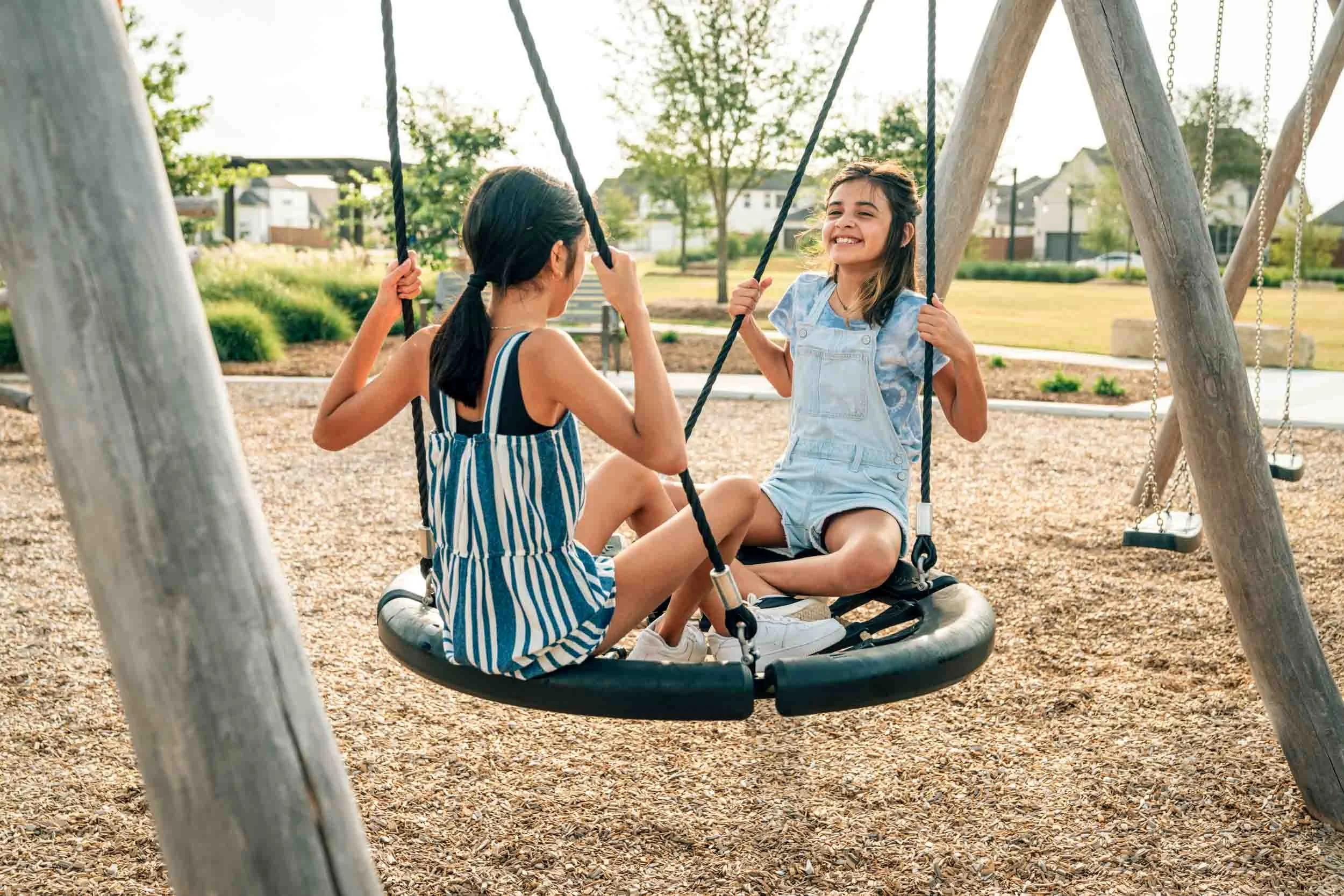 Girls-Swinging-in-Neighborhood-Park.jpg