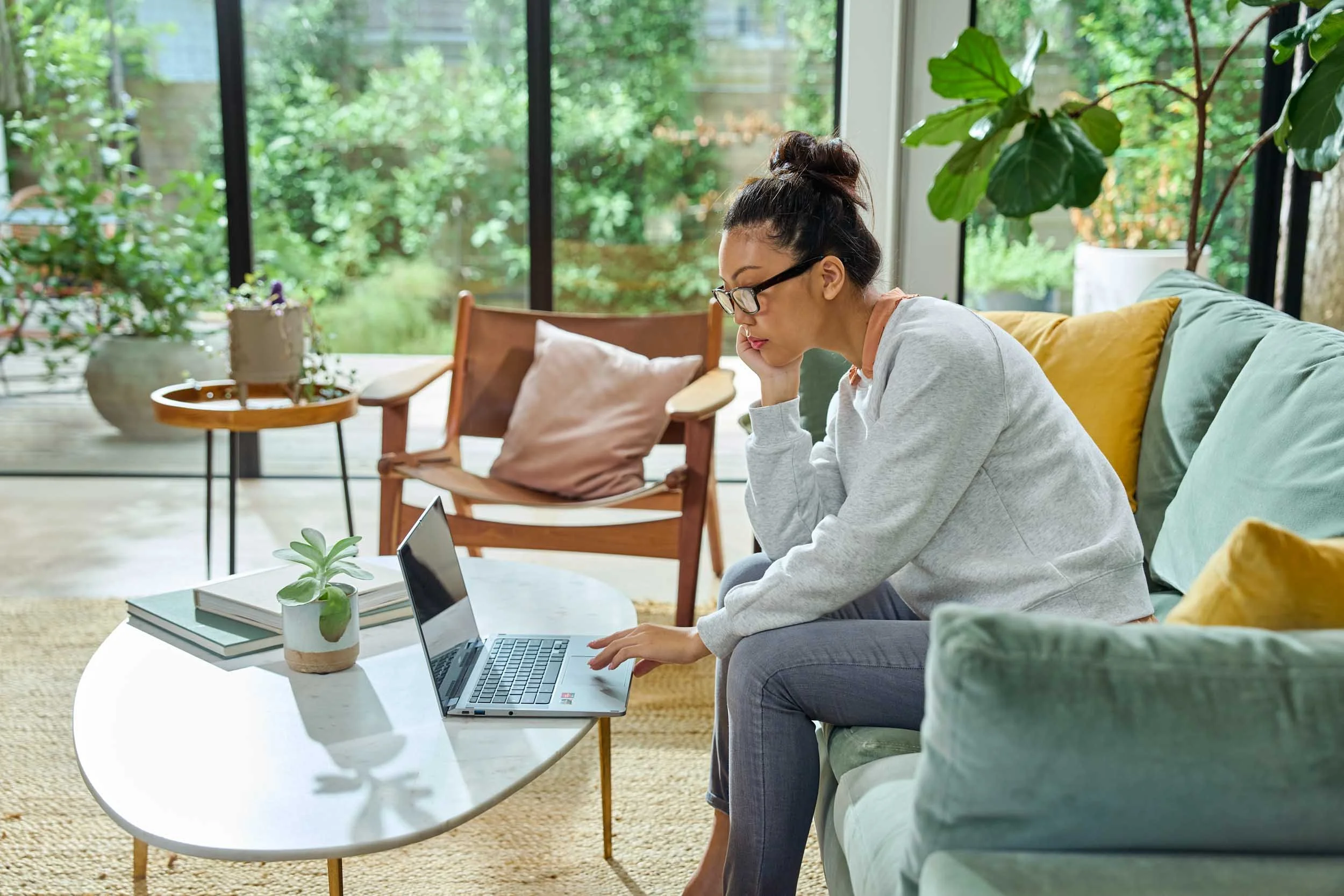 Woman-Using-Laptop-in-Living-Room.jpg