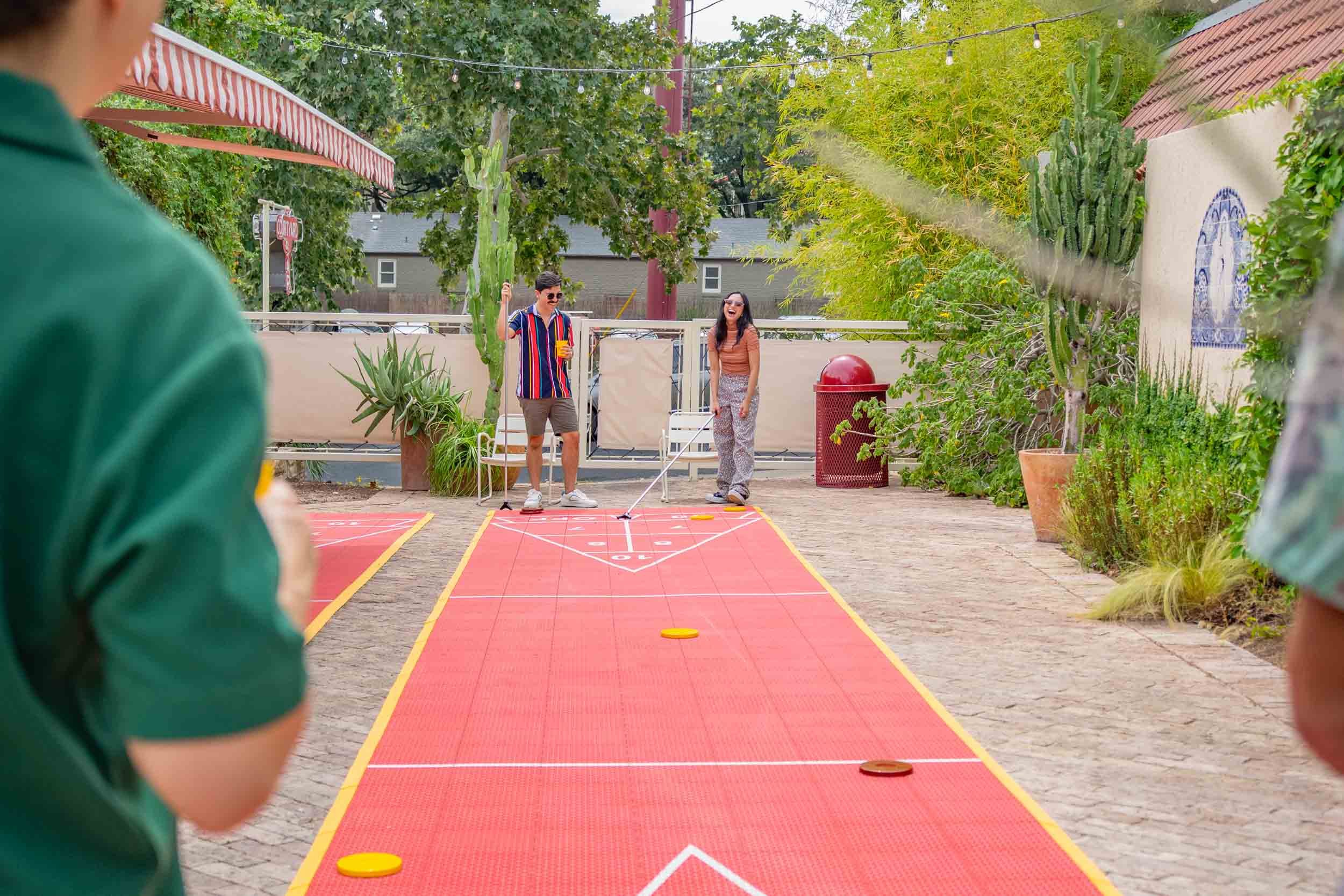 Friends-Playing-Shuffleboard-Outside.jpg