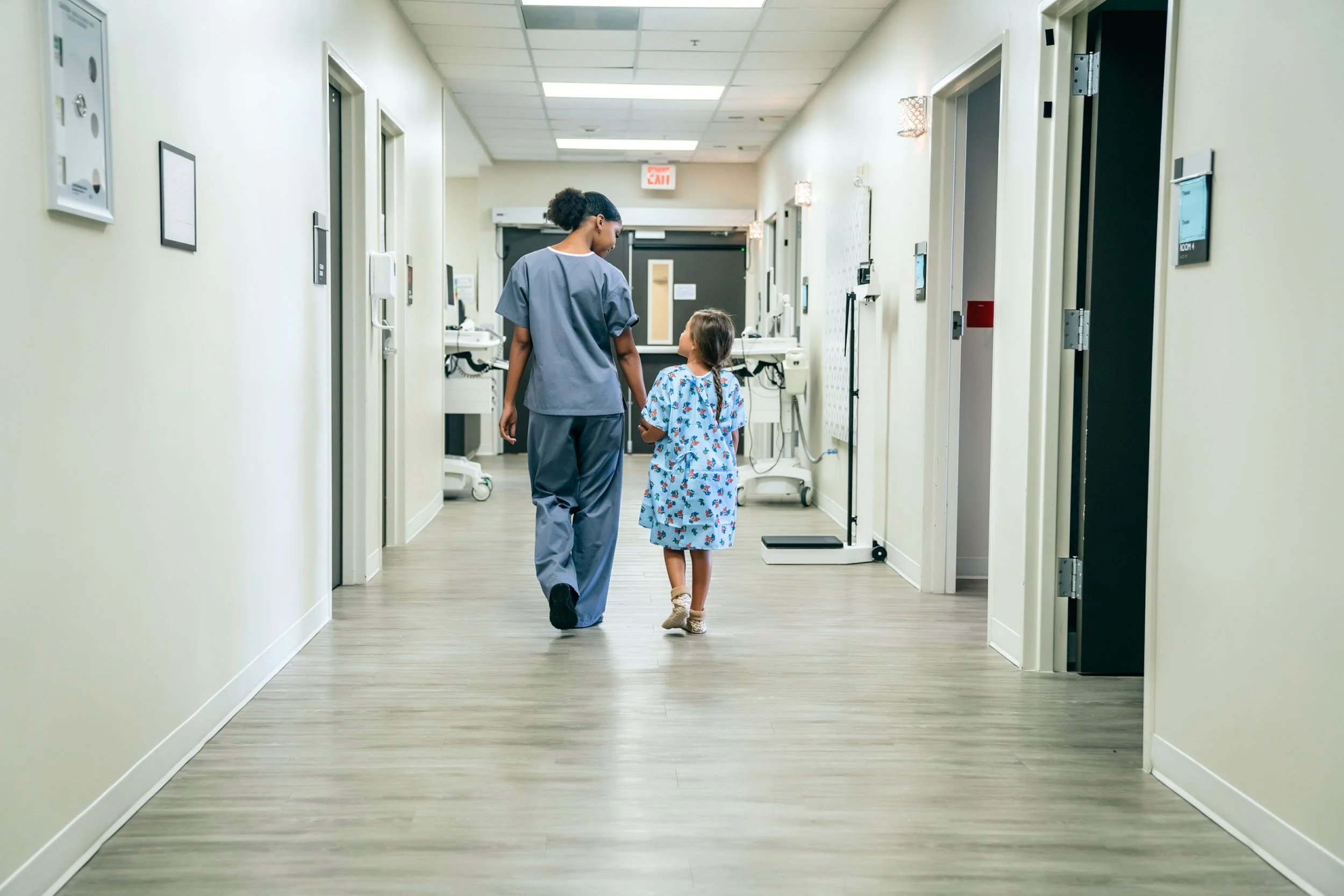 Nurse-and-Child-Walking-in-Hospital.jpg
