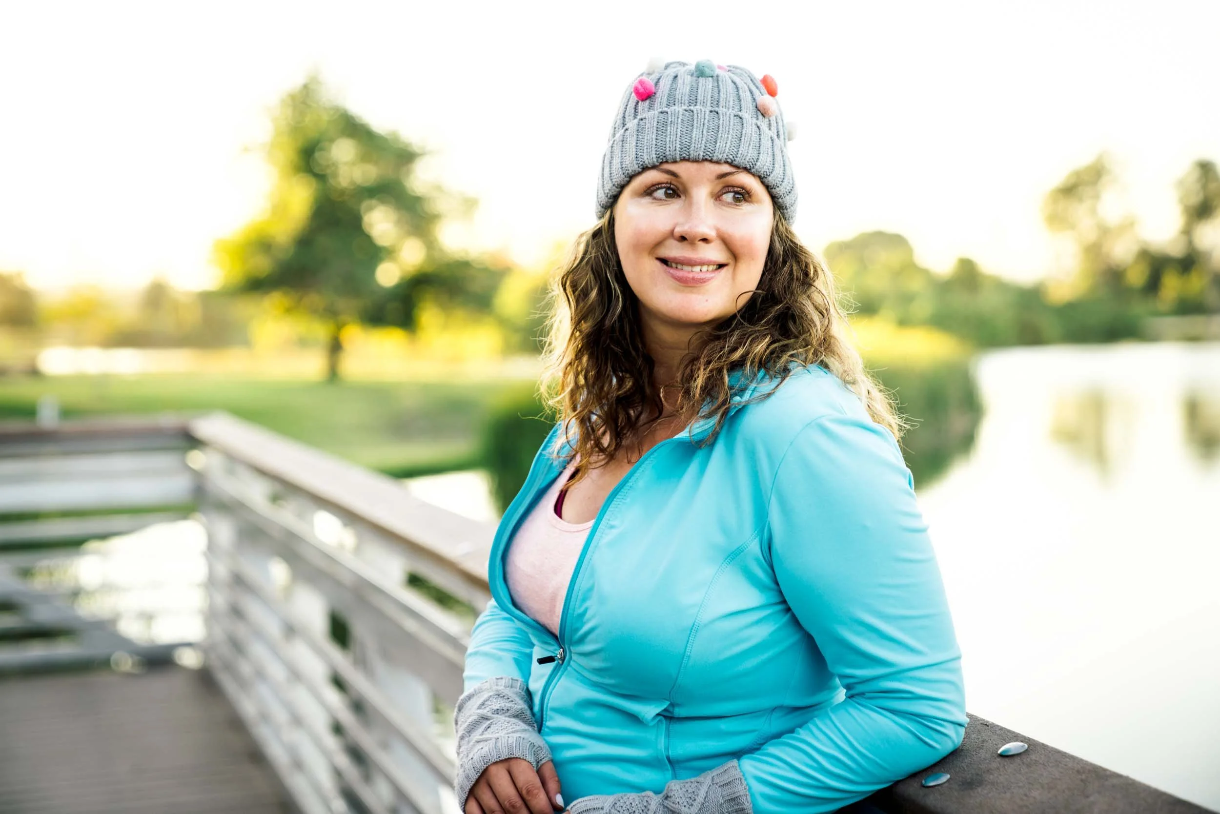 Woman-Smiling-on-Park-Bridge.jpg