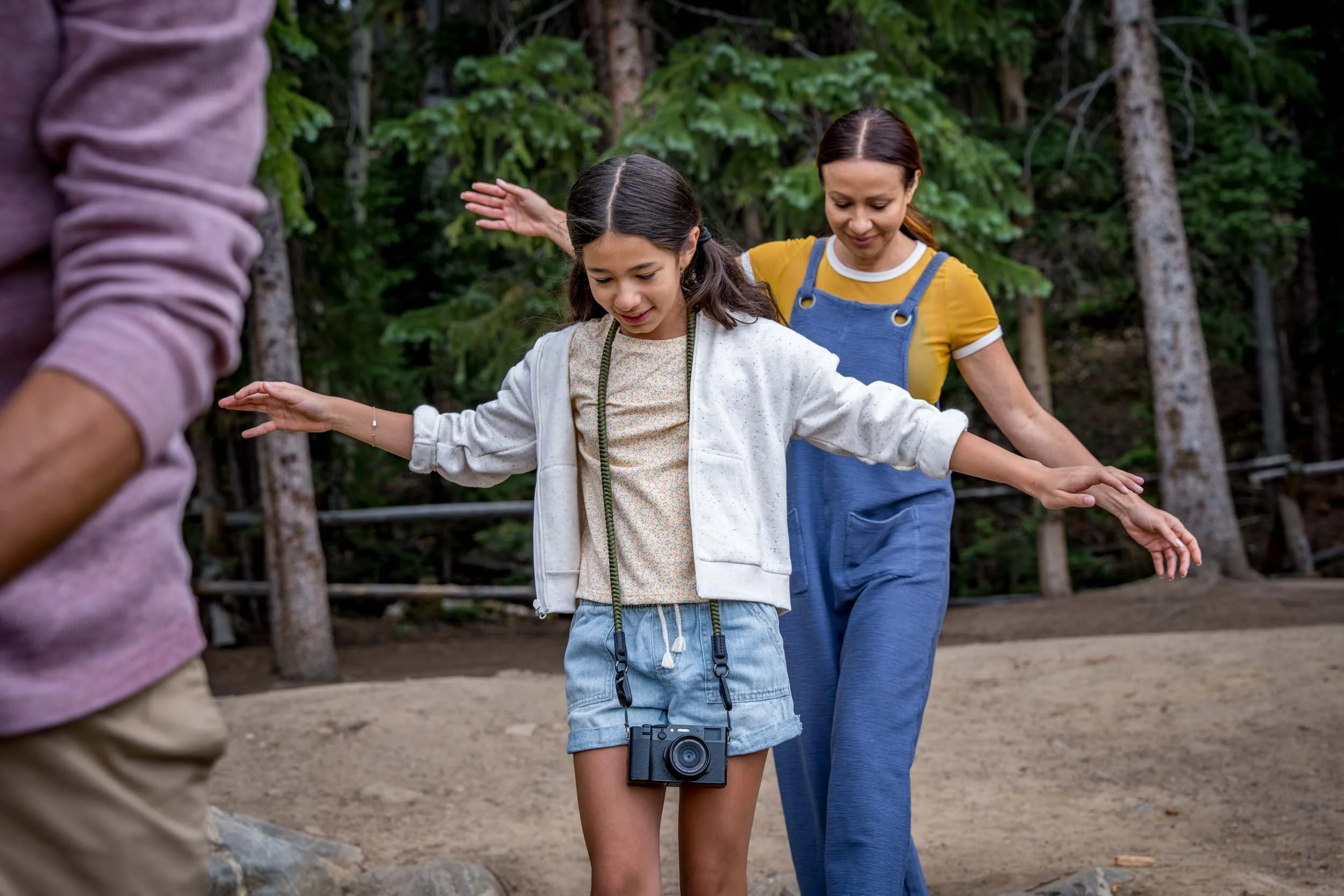 Girl-and-Parents-Walking-in-Forest.jpg