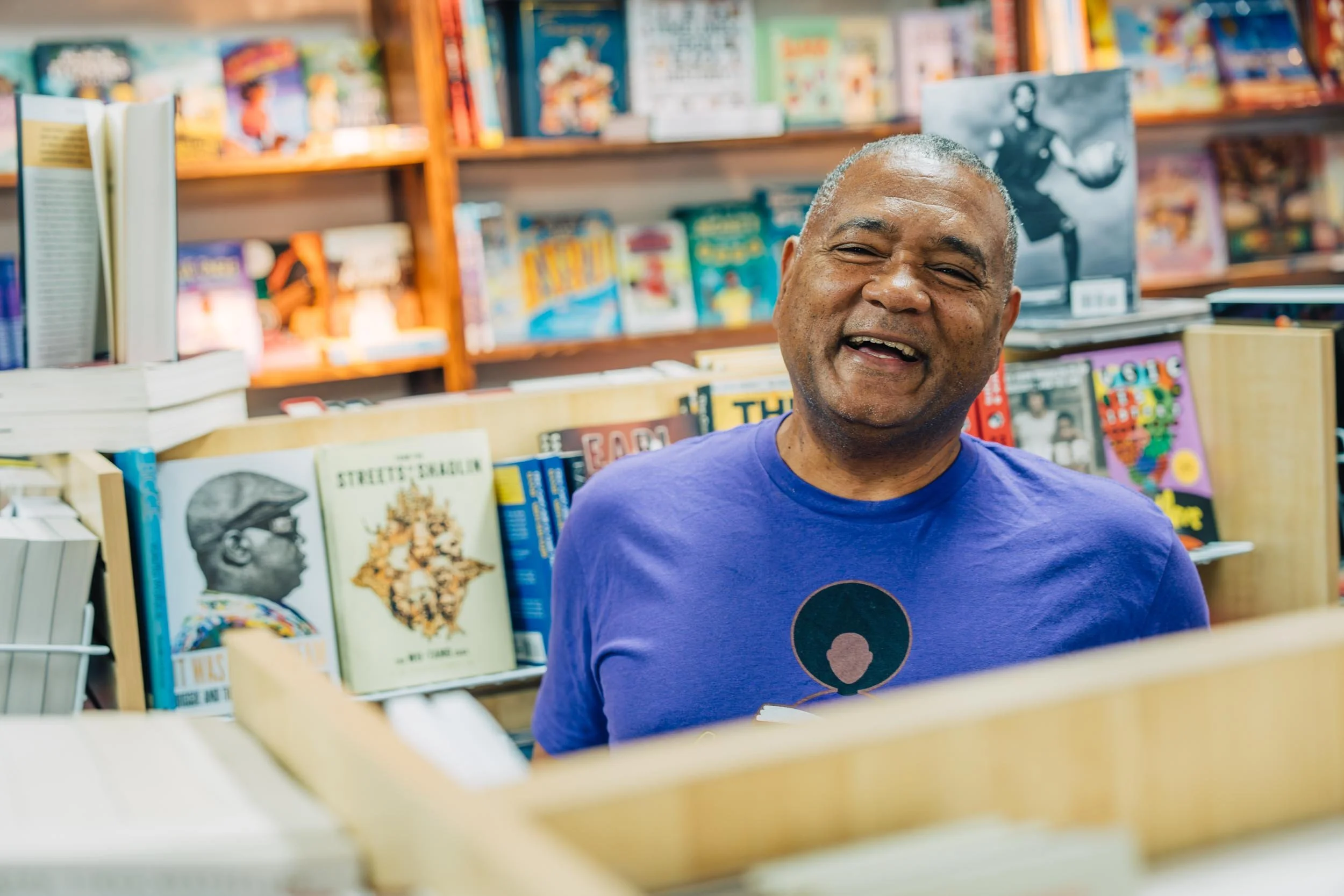 Man-Laughing-in-Bookstore.jpg