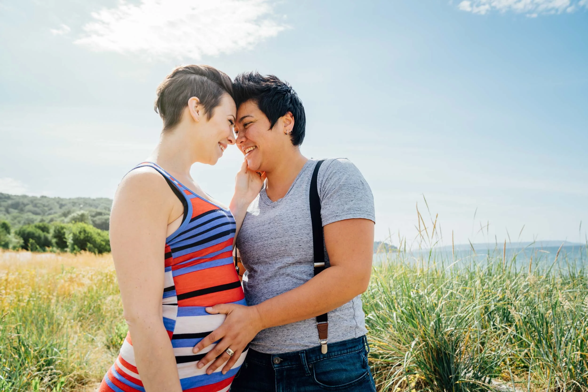 Pregnant-Lesbian-Couple-Embracing-Outdoors.jpg