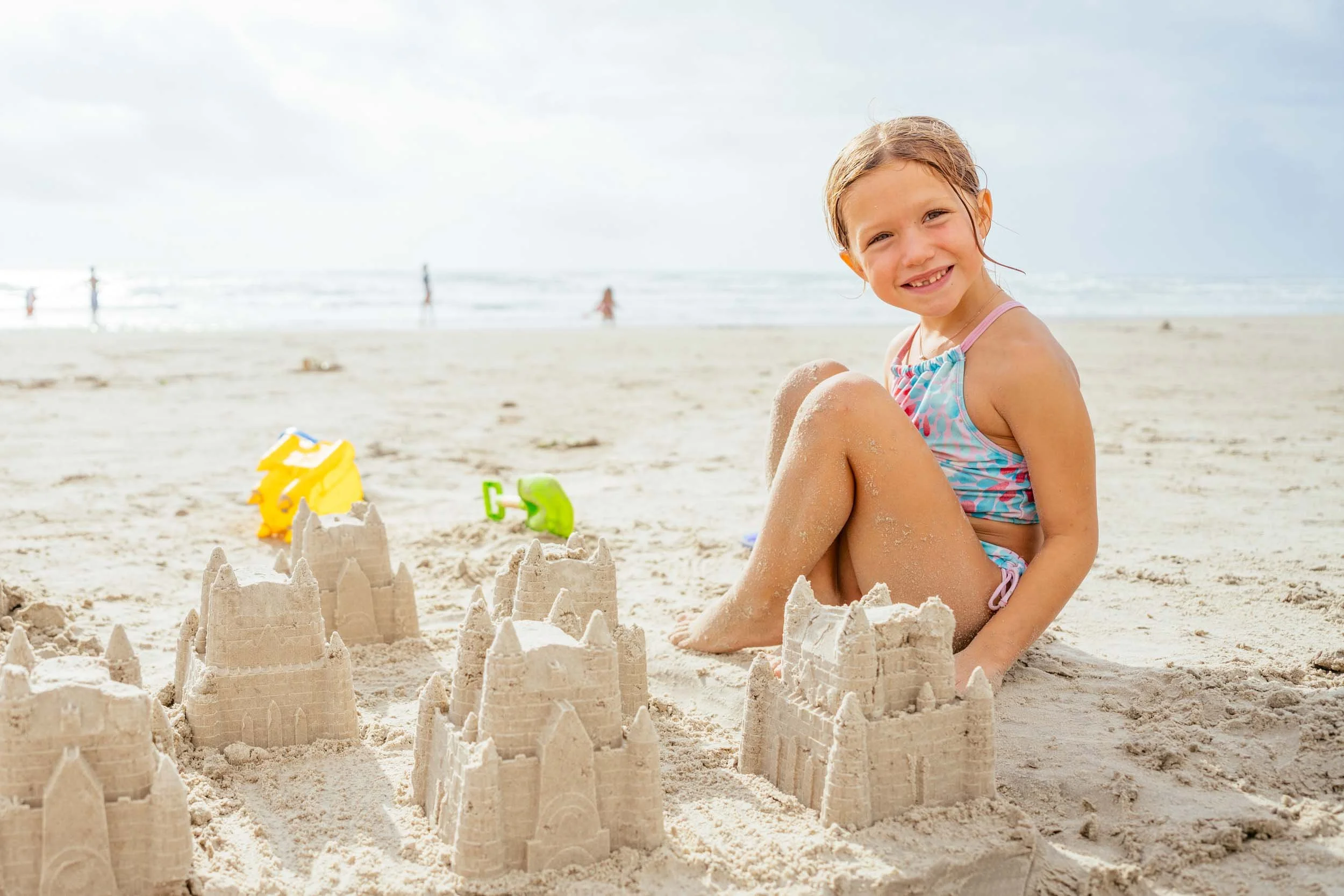Happy-Girl-Building-Sandcastles.jpg