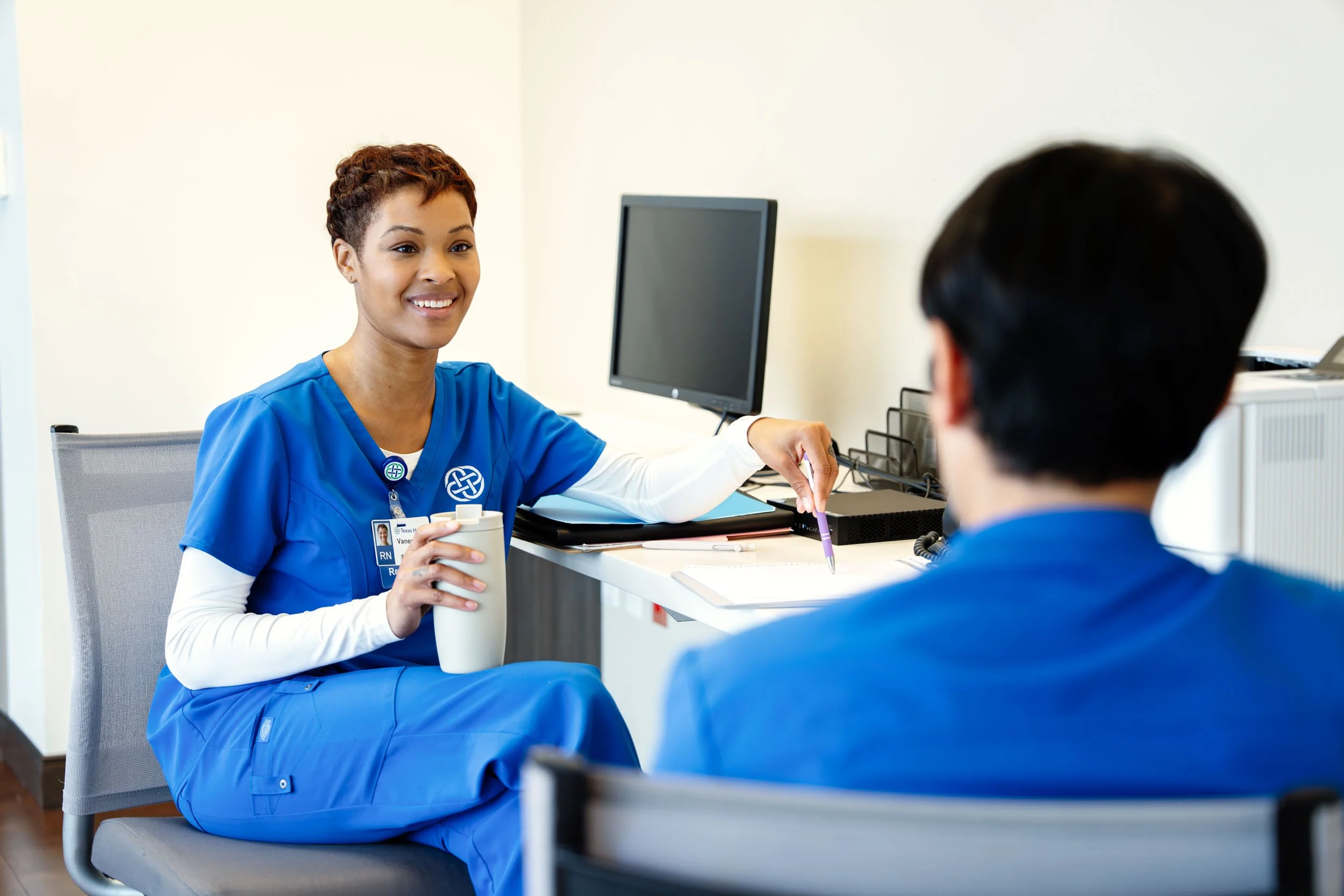Healthcare-Professionals-Meeting-Nurses-Station.jpg