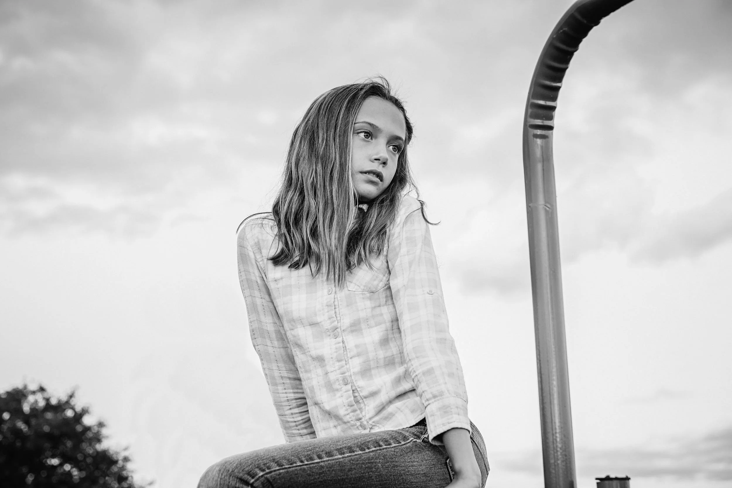 Girl-sitting-on-farm-fence.jpg