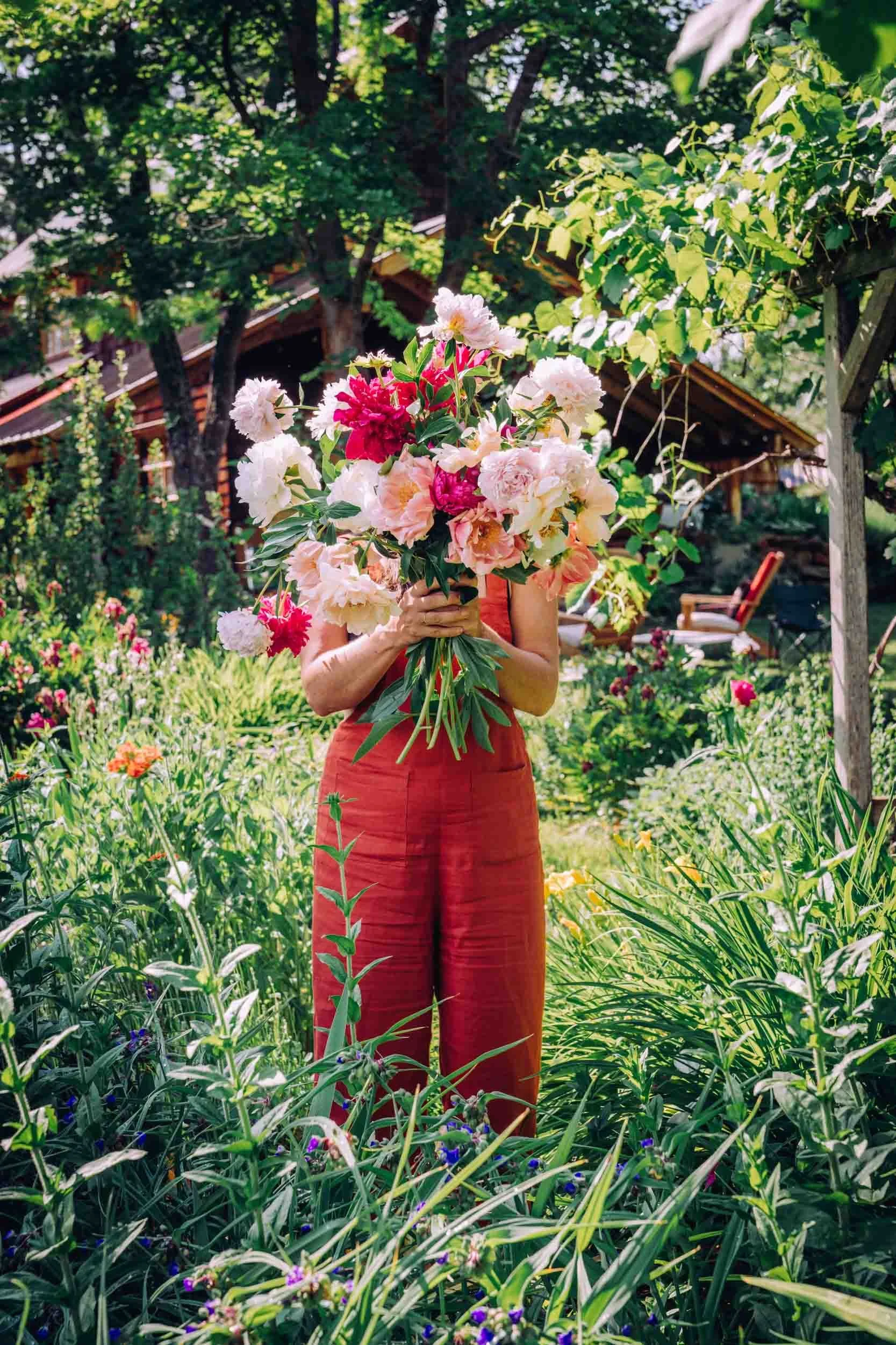 Woman-Holding-Peonies-in-Front-of-Face.jpg