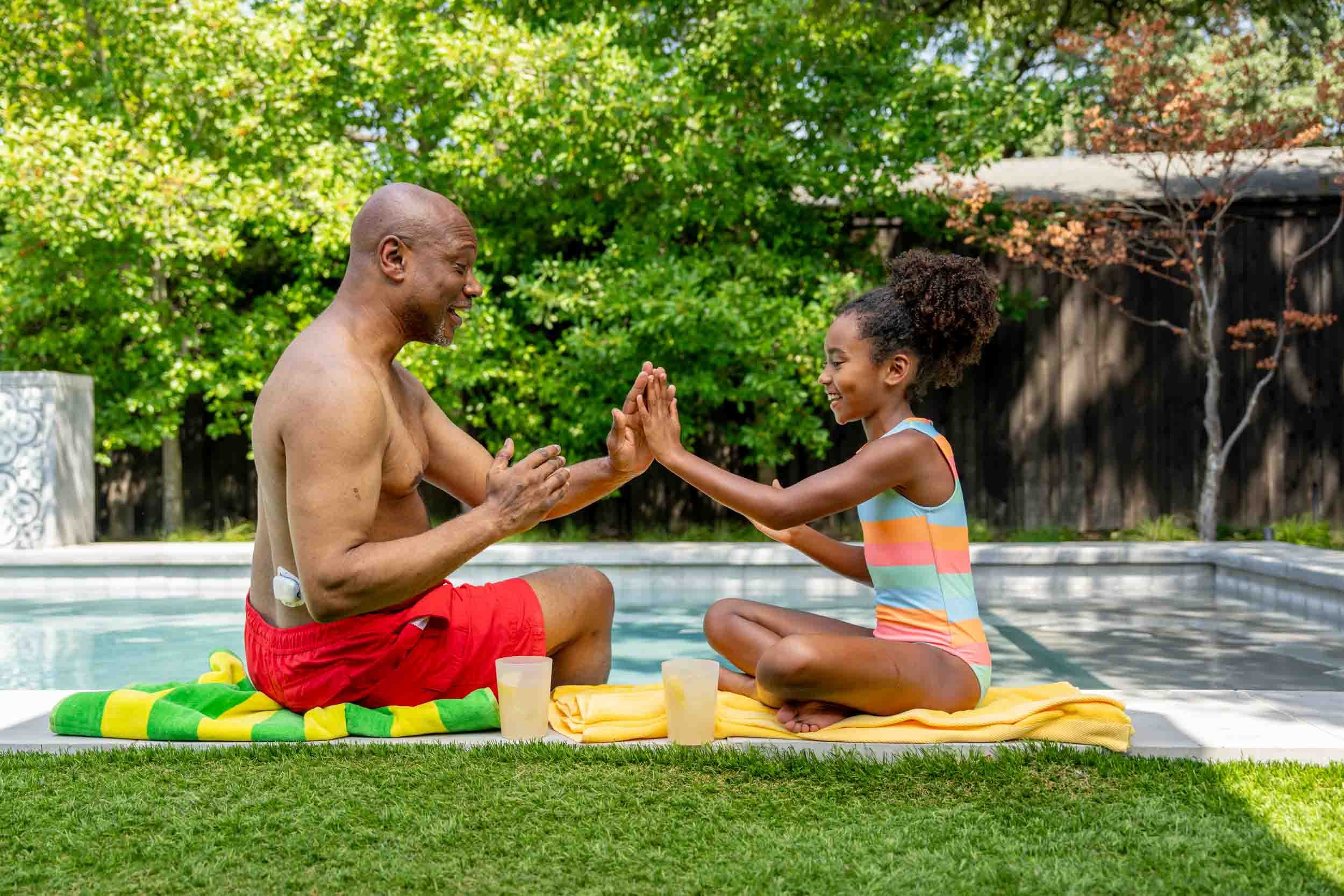 Man-and-Girl-Playing-by-the-Pool.jpg