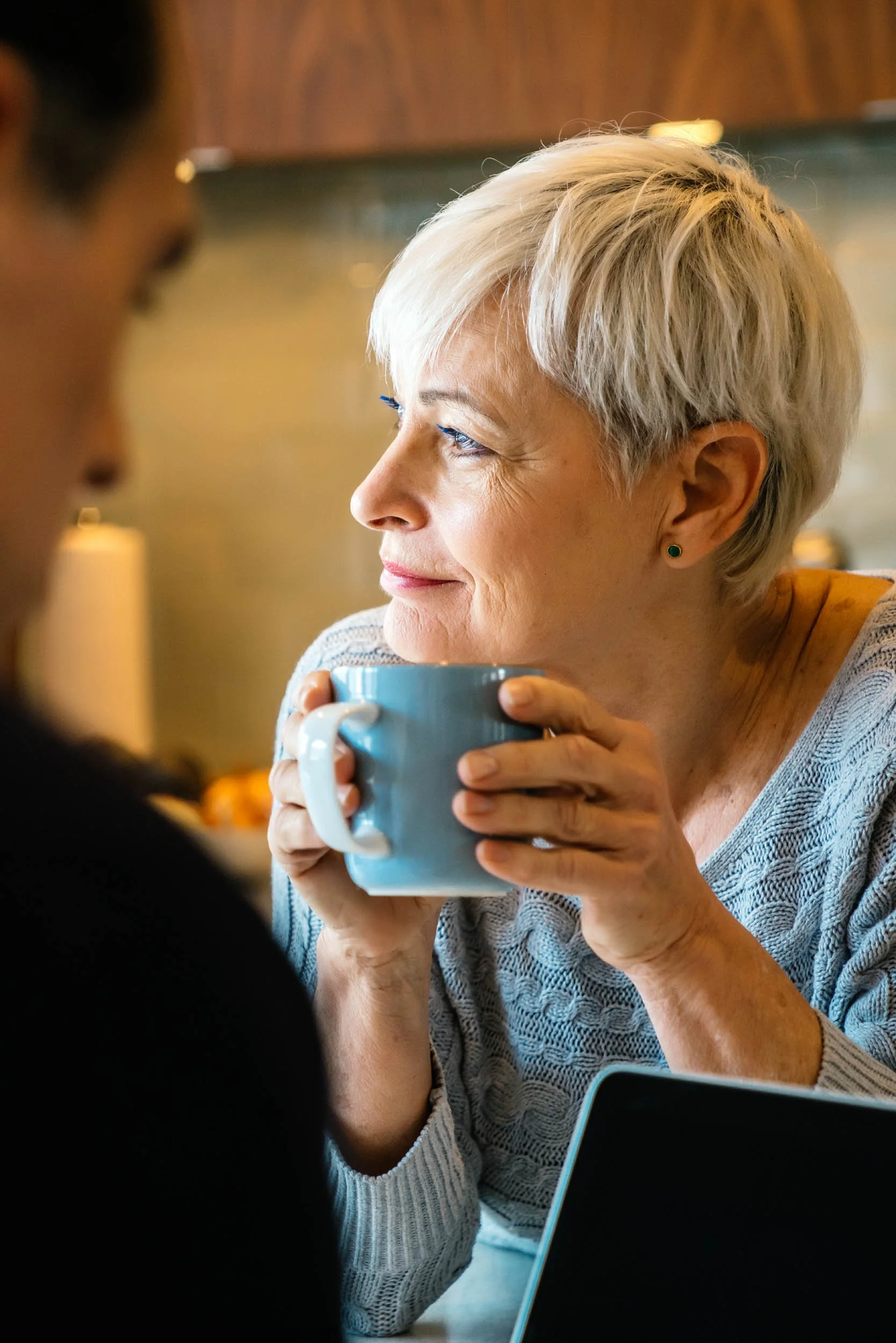Mature-Woman-Holding-Blue-Mug.jpg