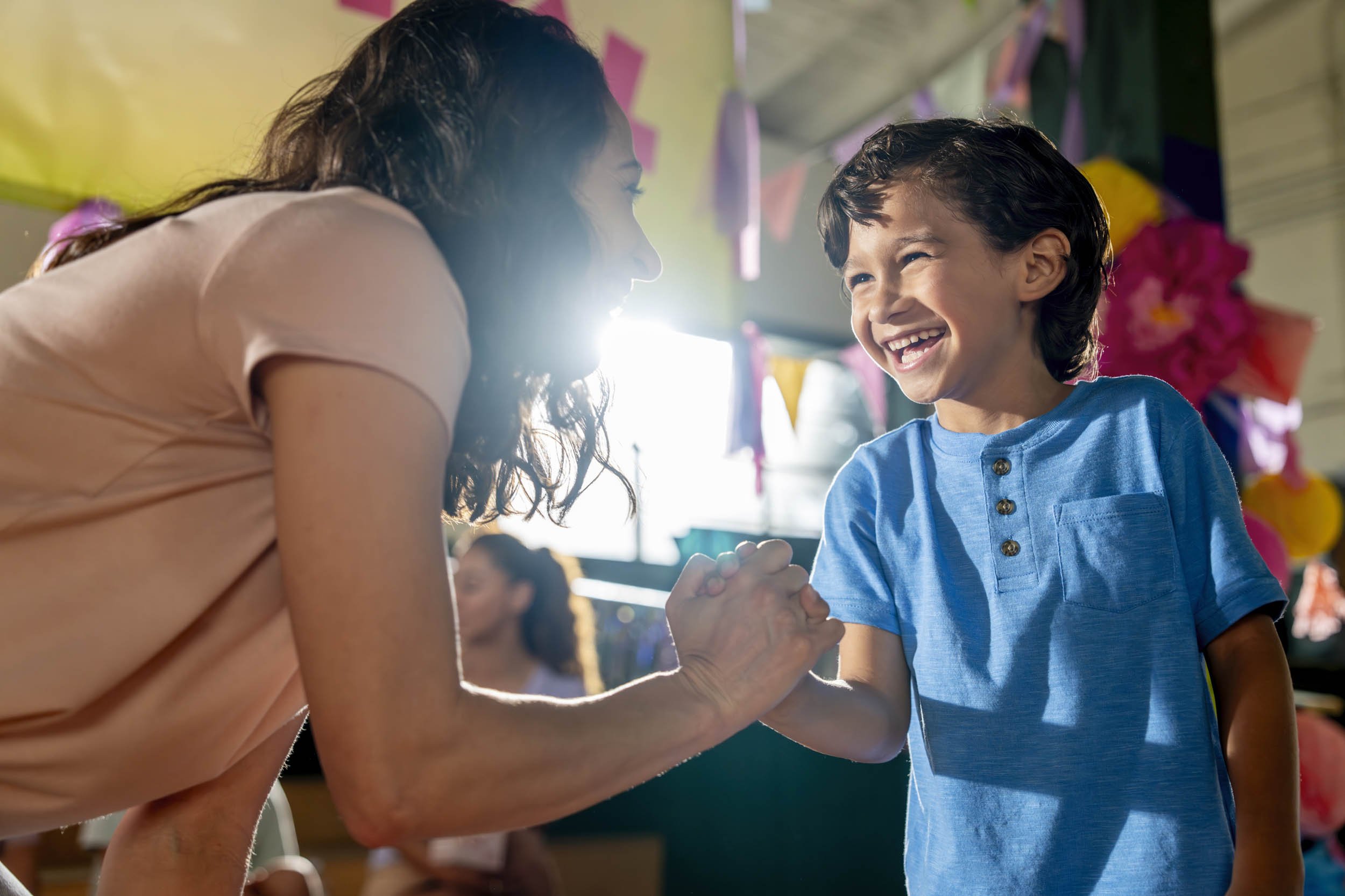 Woman-Congratulating-Boy-at-School-Event.JPG