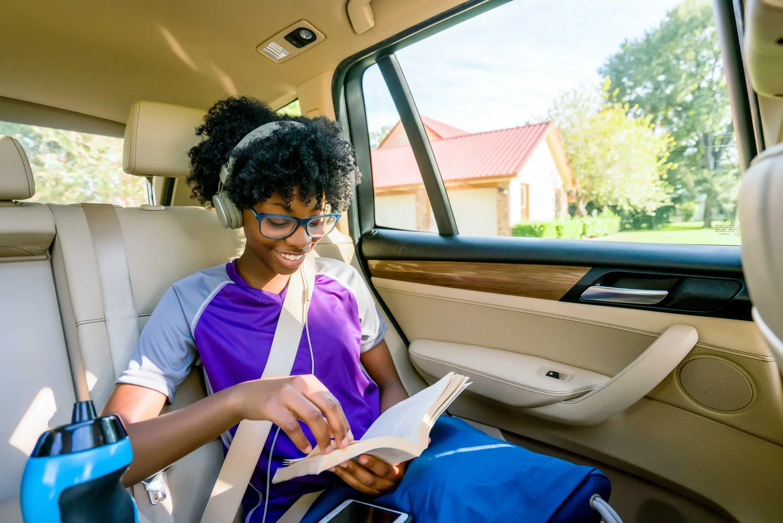 Girl-Reading-Book-in-Car.jpg