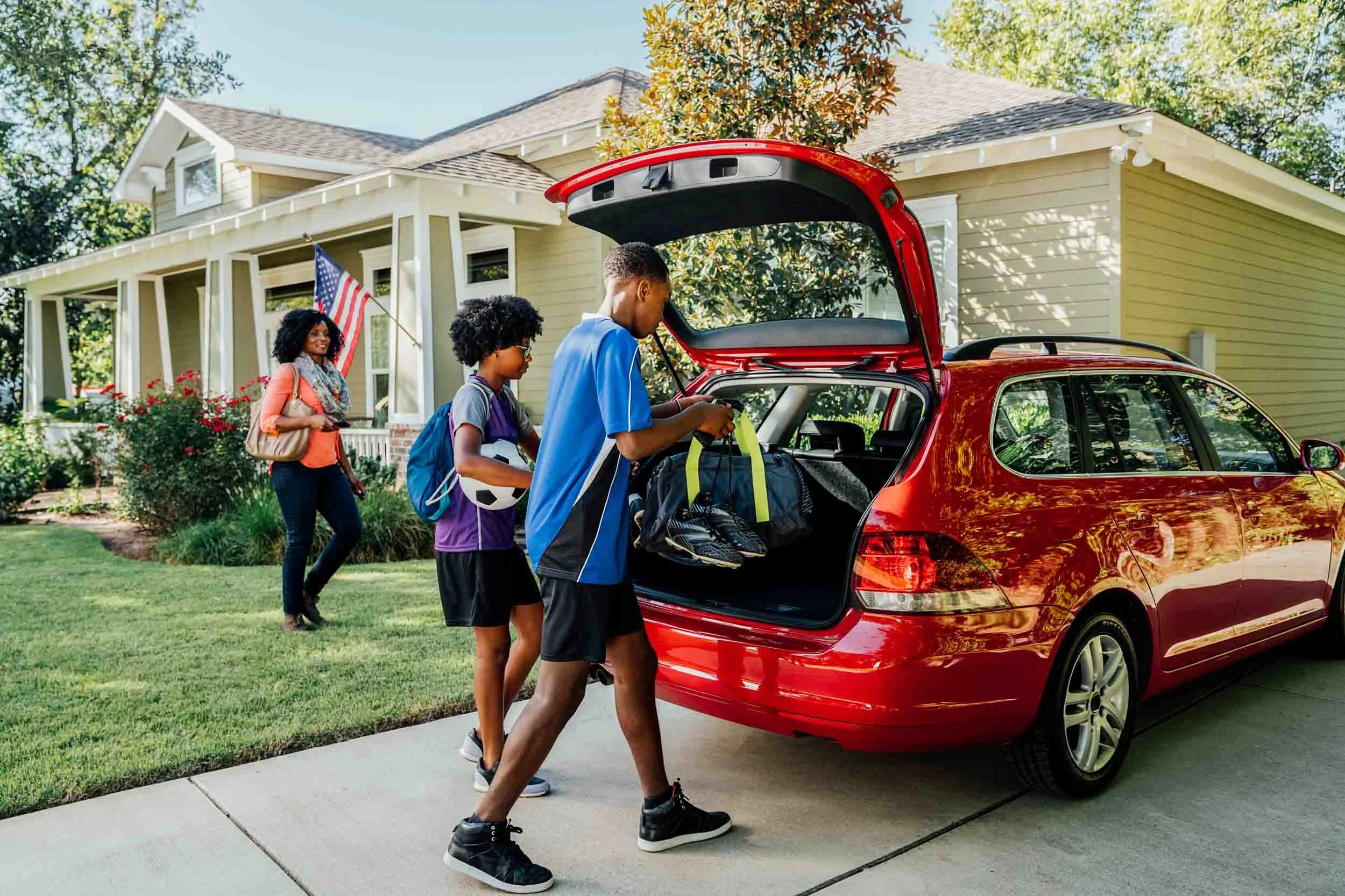 kids-putting-sports-gear-in-car.jpg