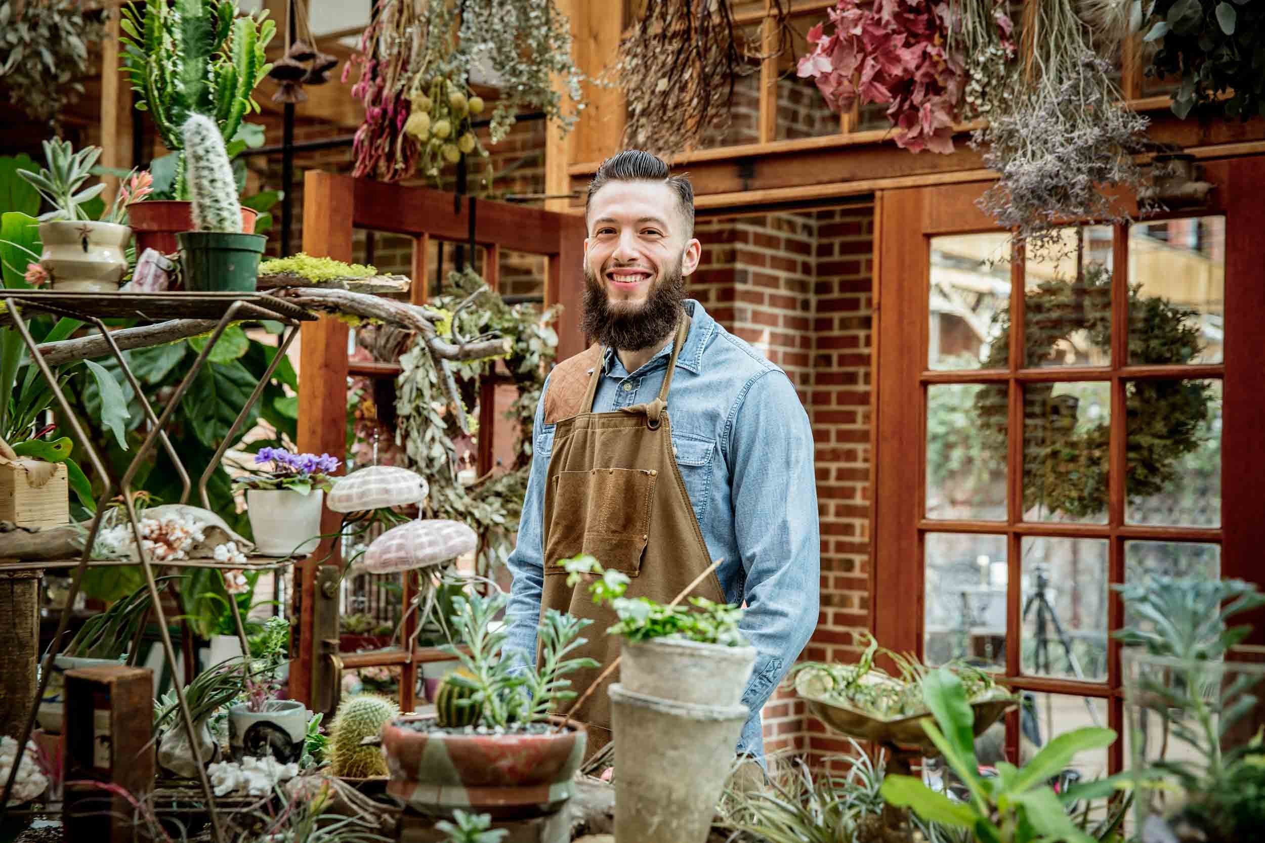 Man-in-Garden-Shop-with-Various-Plants.jpg