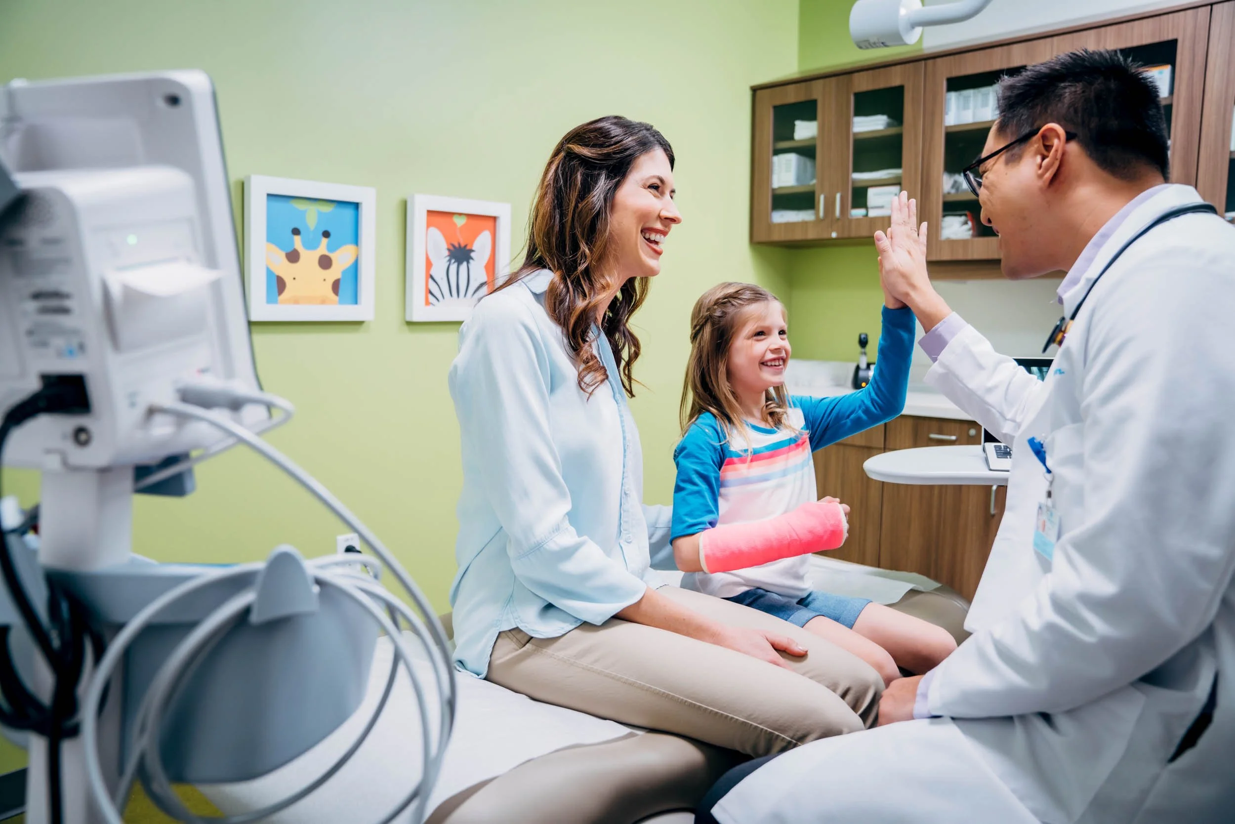 Doctor-High-Fives-Young-Patient.jpg