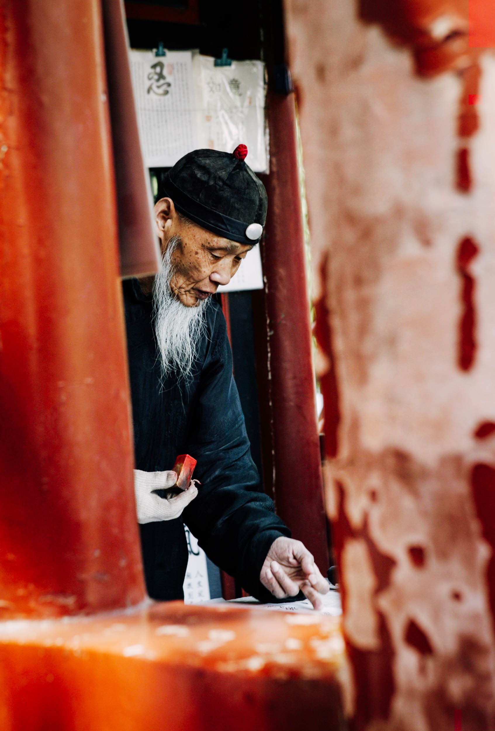 Elderly-Chinese-Man-with-Stamp.jpg
