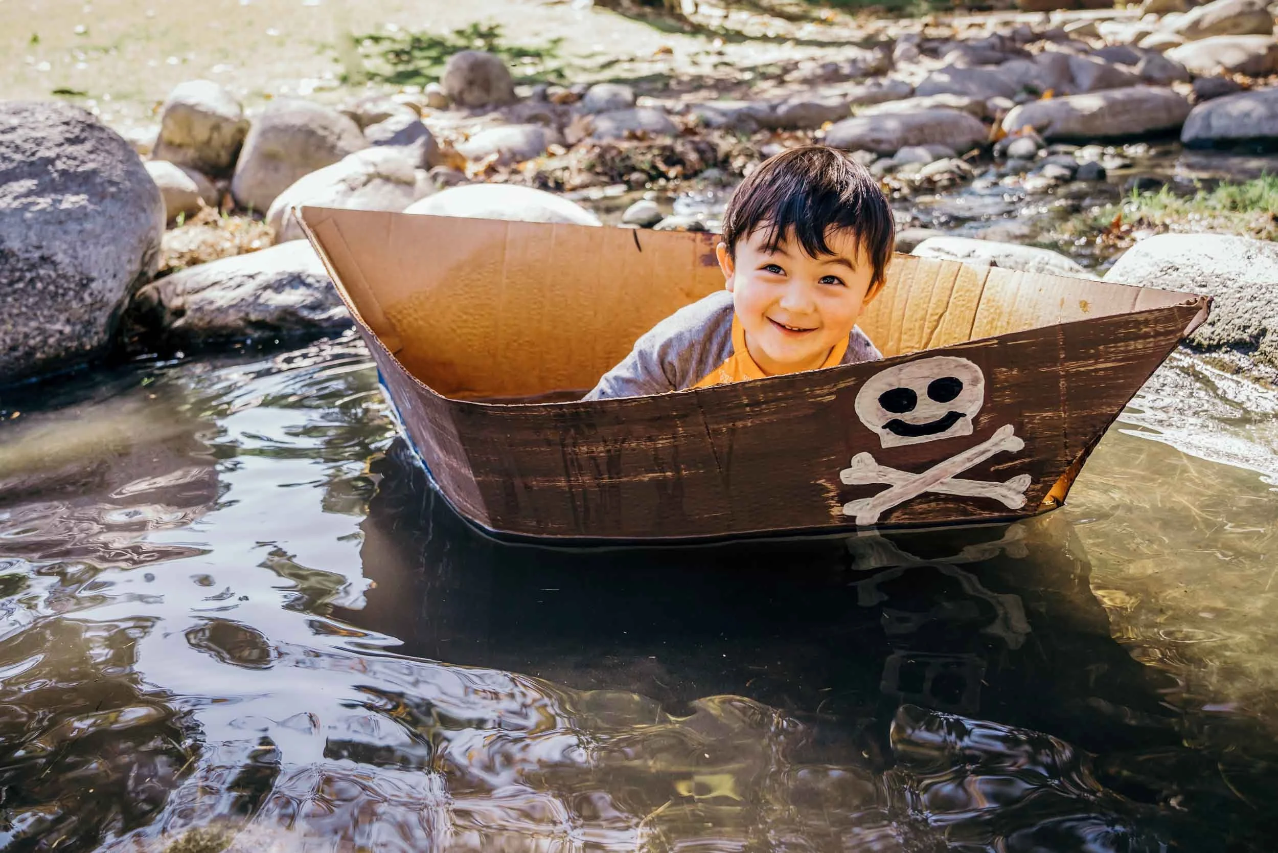 Child-in-Cardboard-Boat-in-Creek.jpg