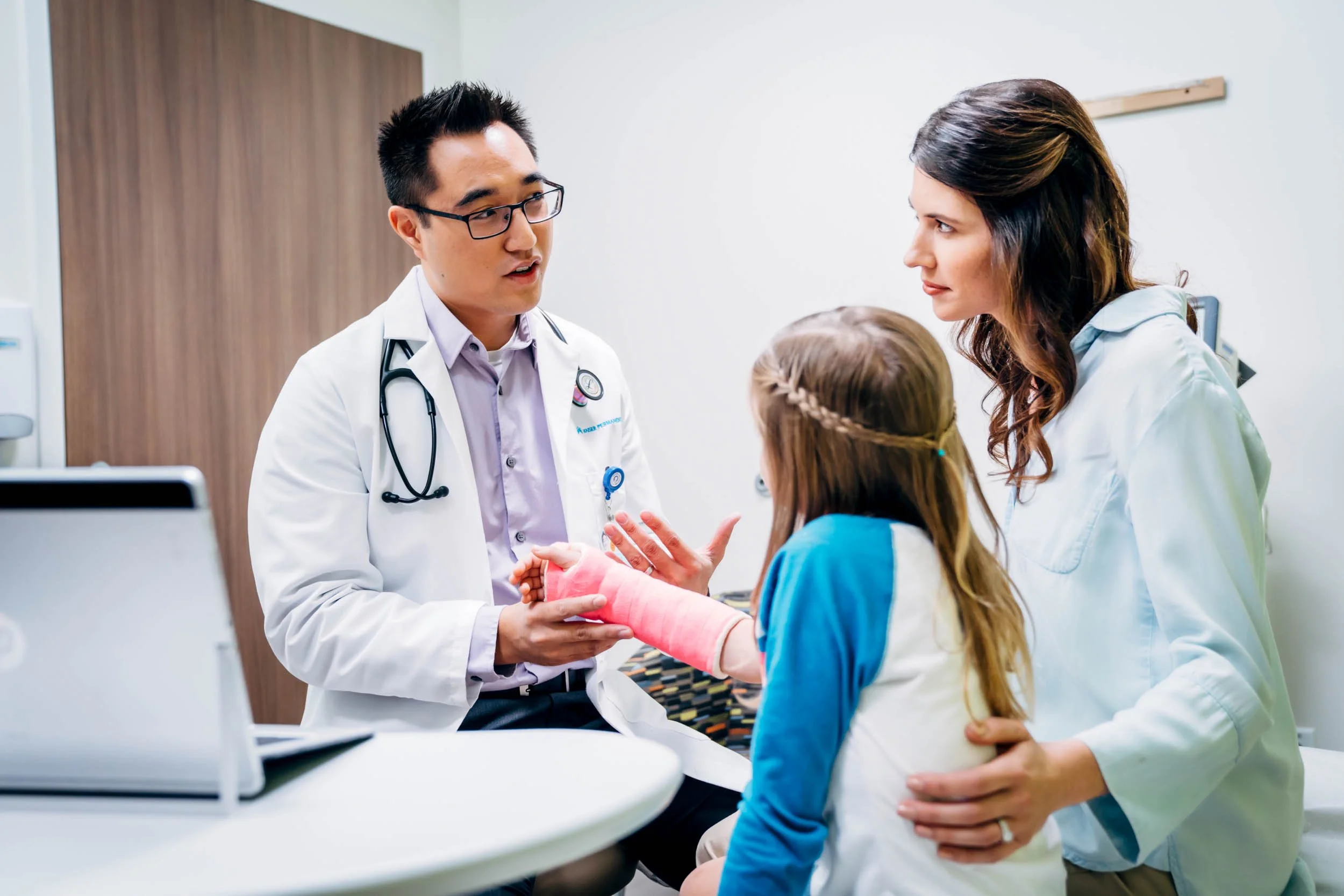 Doctor-Consults-Child-with-Cast.jpg
