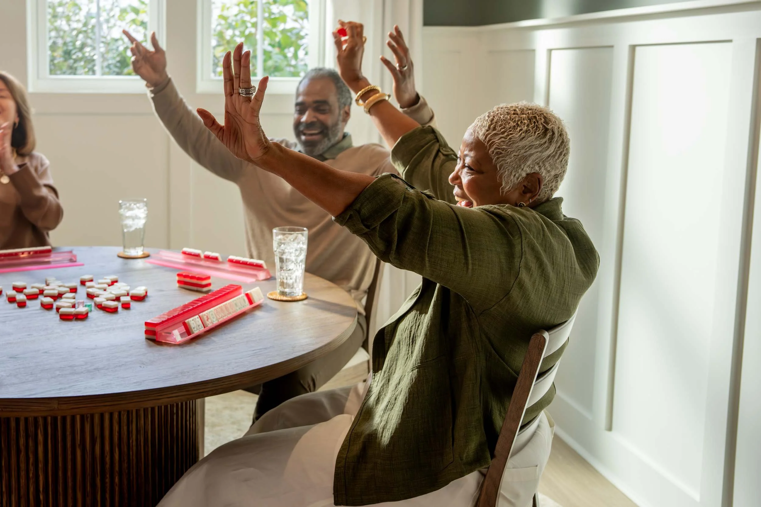 Group-of-Friends-Joyfully-Playing-Mahjong.jpg