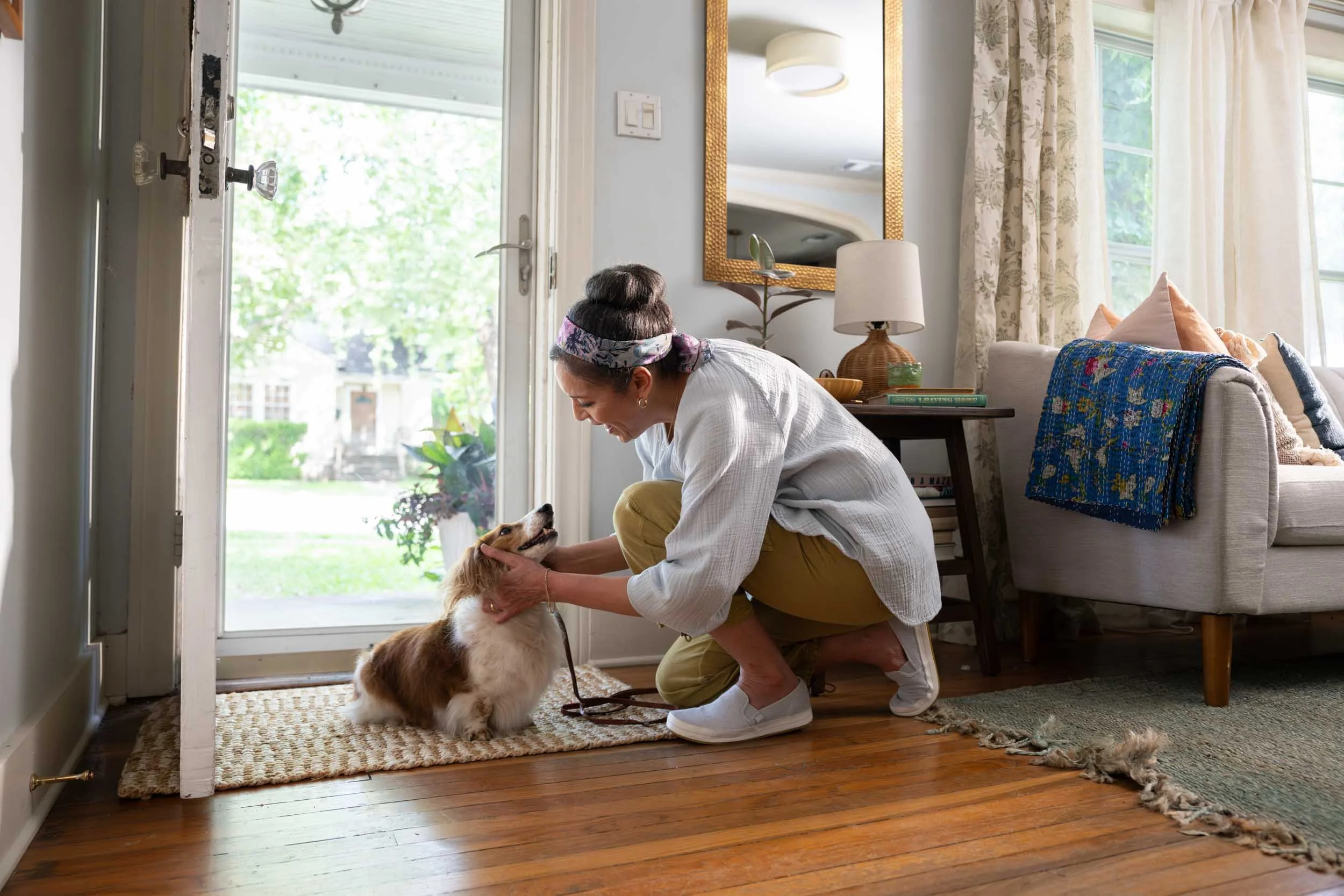 Woman-Petting-Dog-in Home.jpg