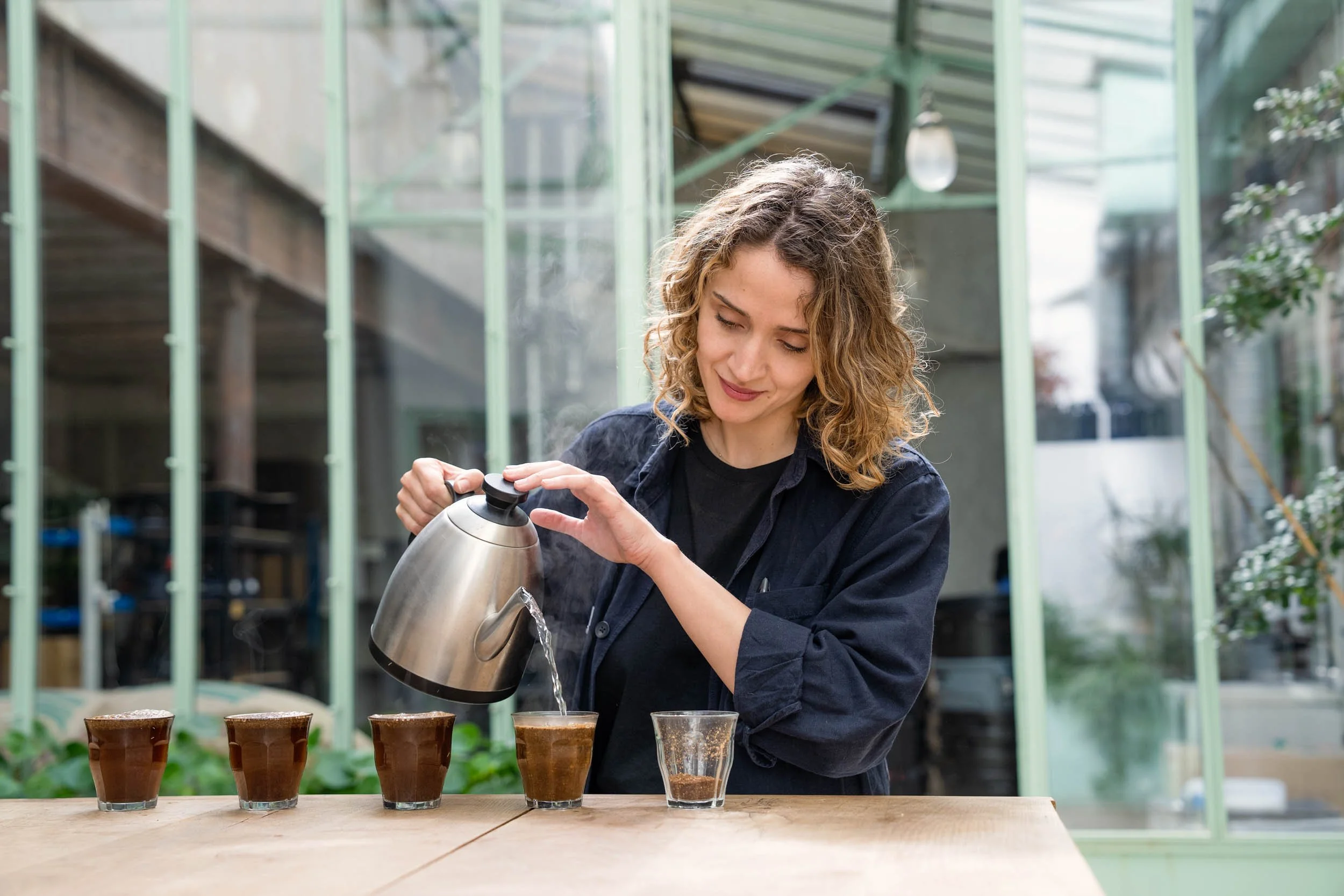Woman-Preparing-Coffee-Tasting.jpg
