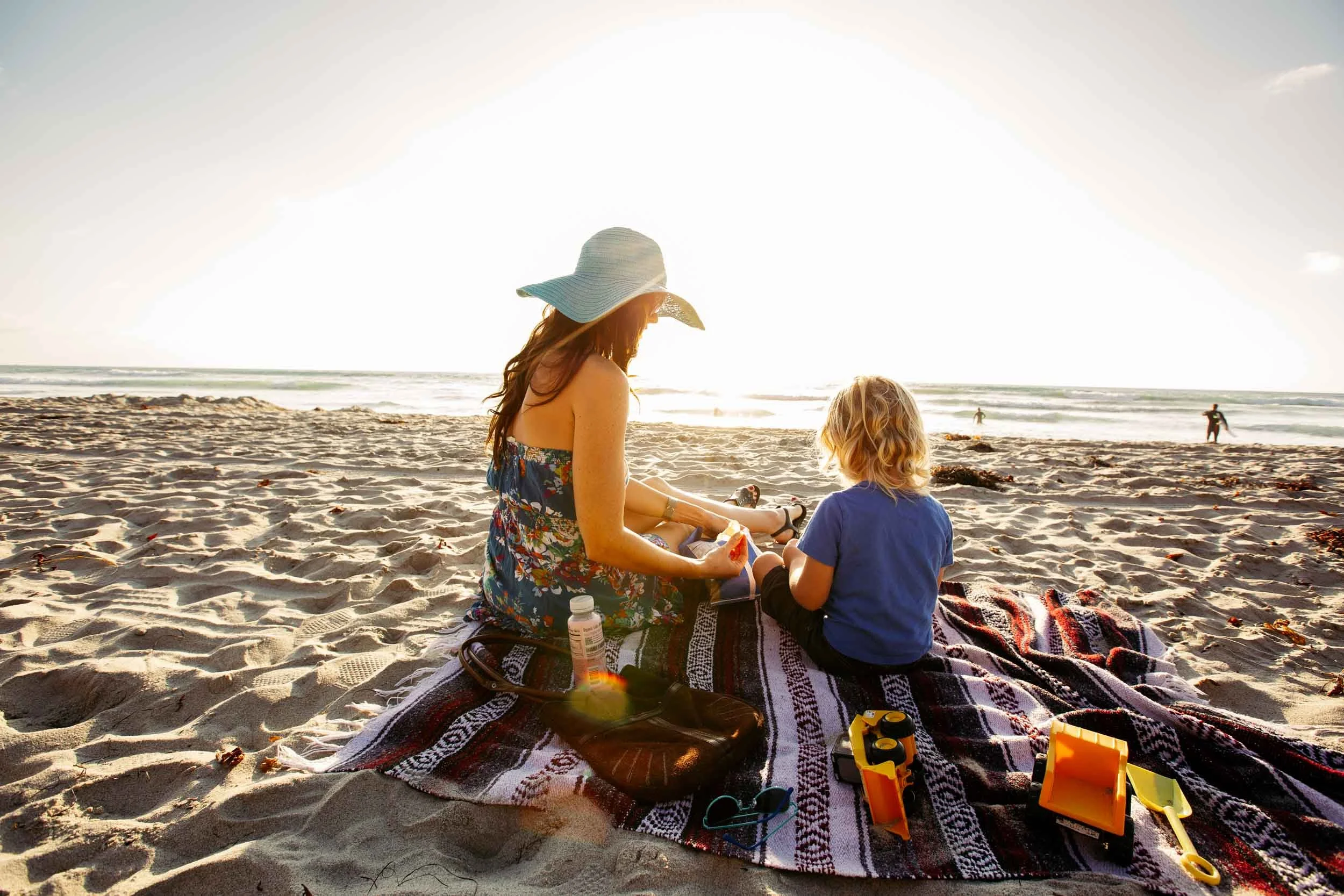Woman-and-Child-Relaxing-at-the-Beach.jpg