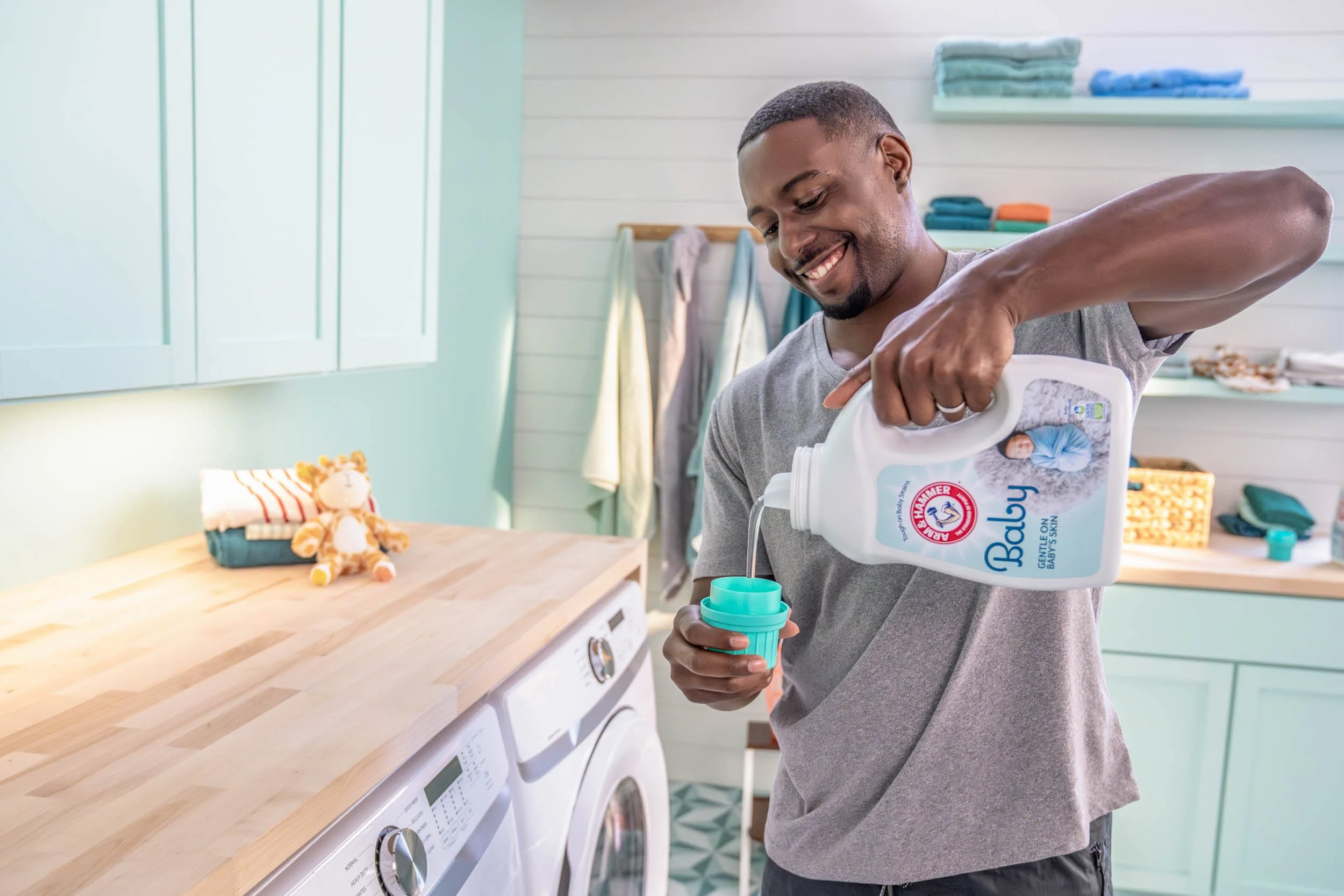 Man-Pouring-Baby-Laundry-Detergent.jpg