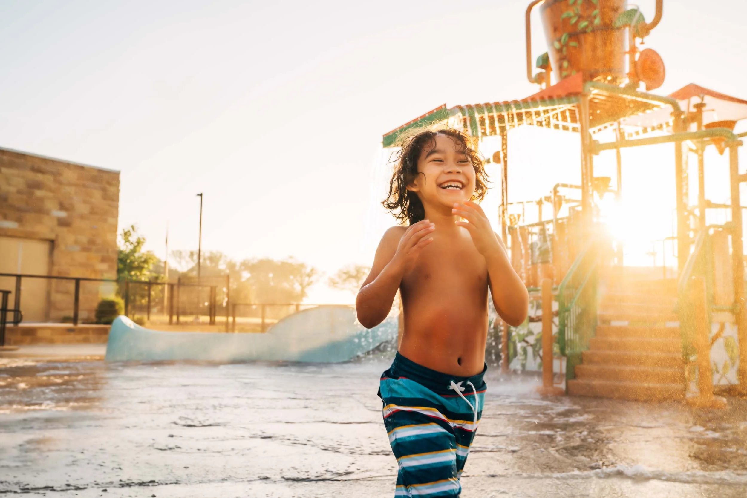 Boy-Playing-at-Water-Park.jpg